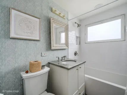 a bathroom with a sink a toilet and a bathtub