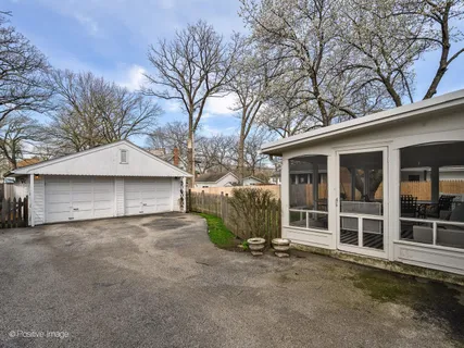 a view of a house with a outdoor space and backyard