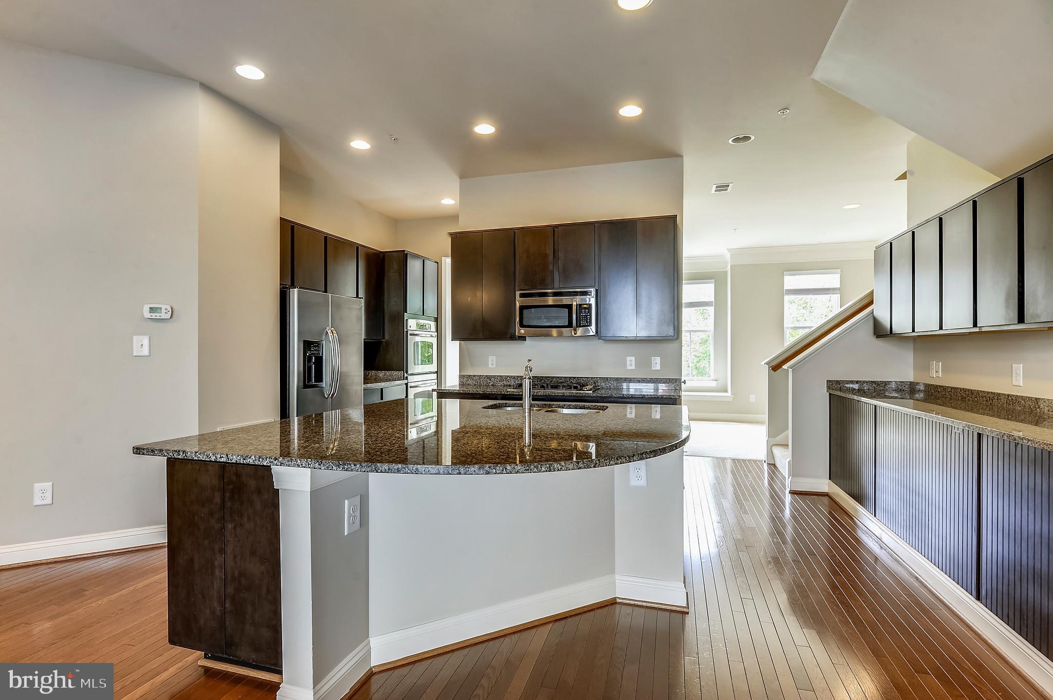 9852 Garden Ranges Laurel, MD 20723 - Photo 6 of 26 Kitchen with Breakfast Bar