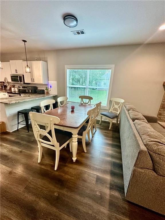 815 Poplar Street Monticello, GA 31064 - Photo 8 of 33 a dining room with furniture and wooden floor