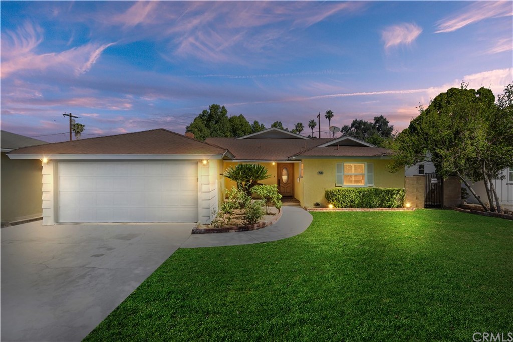 7535 Delaware Street Riverside, CA 92504 - Photo 1 of 1 a front view of a house with a garden and yard