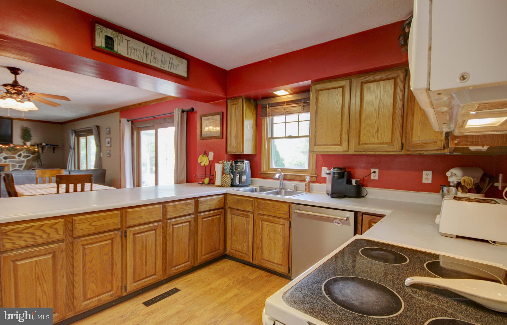 215 Hoffecker Road Phoenixville, PA 19460 - Photo 13 of 49 a kitchen with a sink stove and cabinets