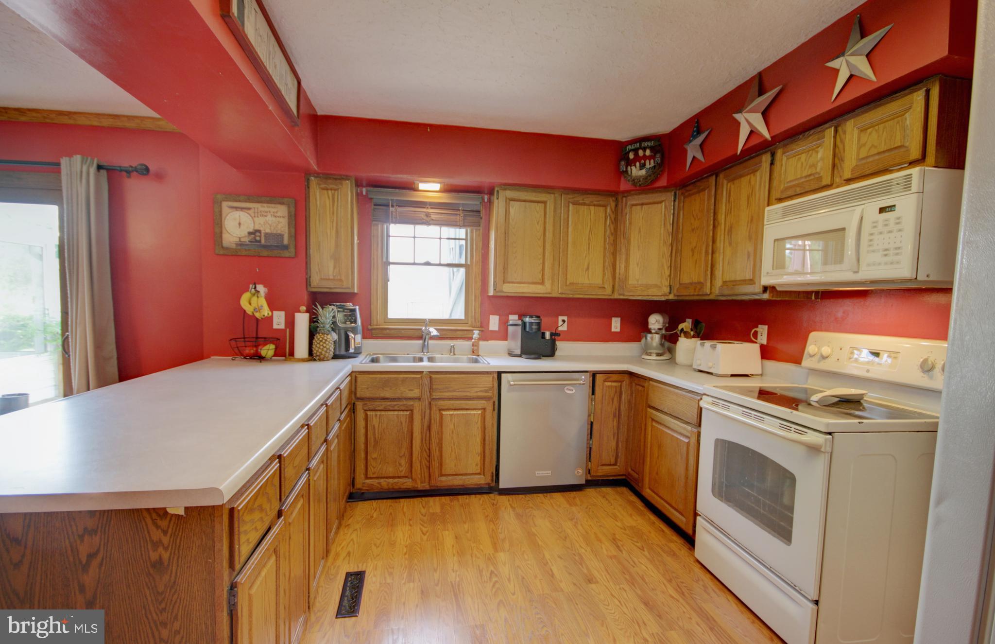 215 Hoffecker Road Phoenixville, PA 19460 - Photo 14 of 49 a kitchen with a stove a sink and a refrigerator