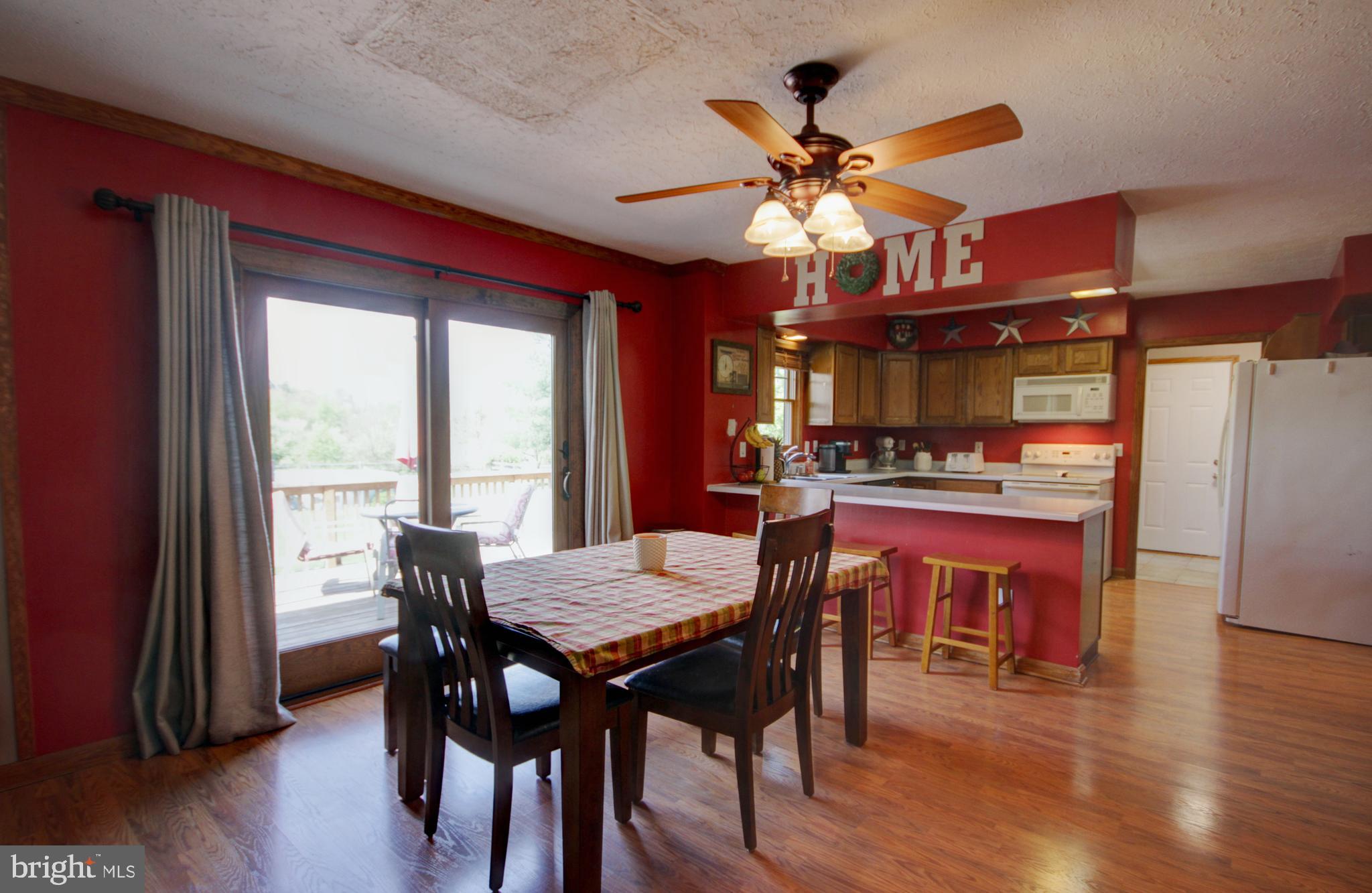 215 Hoffecker Road Phoenixville, PA 19460 - Photo 15 of 49 a view of a dining room with furniture window and wooden floor