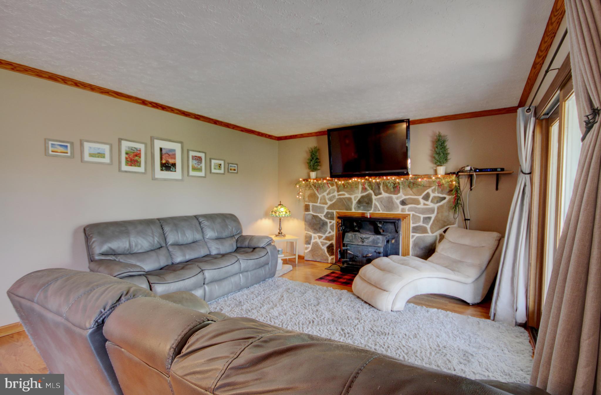 215 Hoffecker Road Phoenixville, PA 19460 - Photo 20 of 49 a living room with furniture and a flat screen tv
