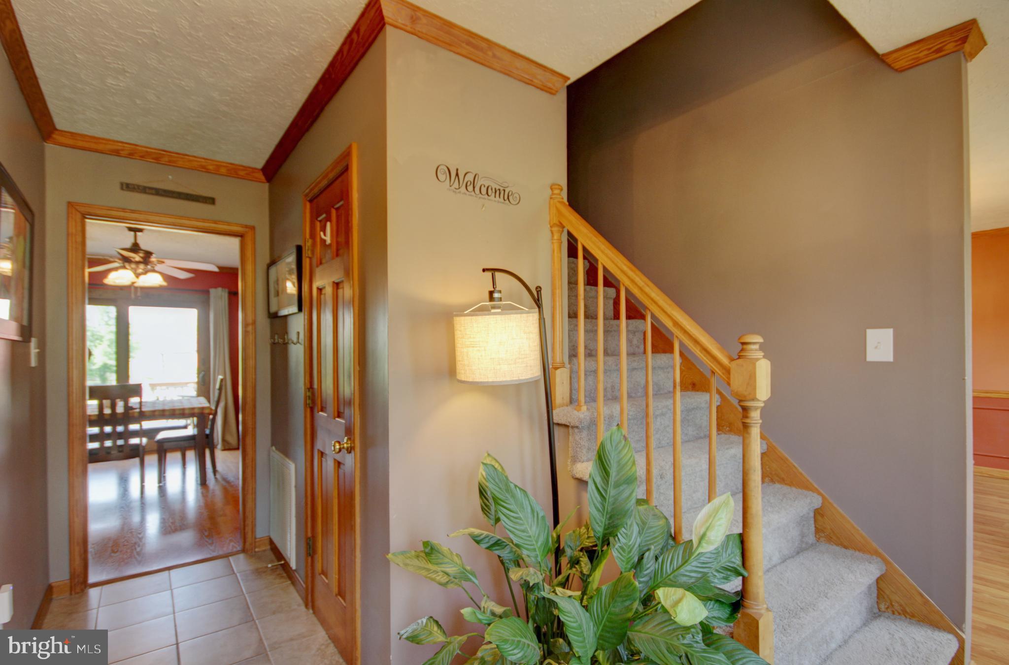 215 Hoffecker Road Phoenixville, PA 19460 - Photo 2 of 49 a view of a hallway with wooden floor and stairs