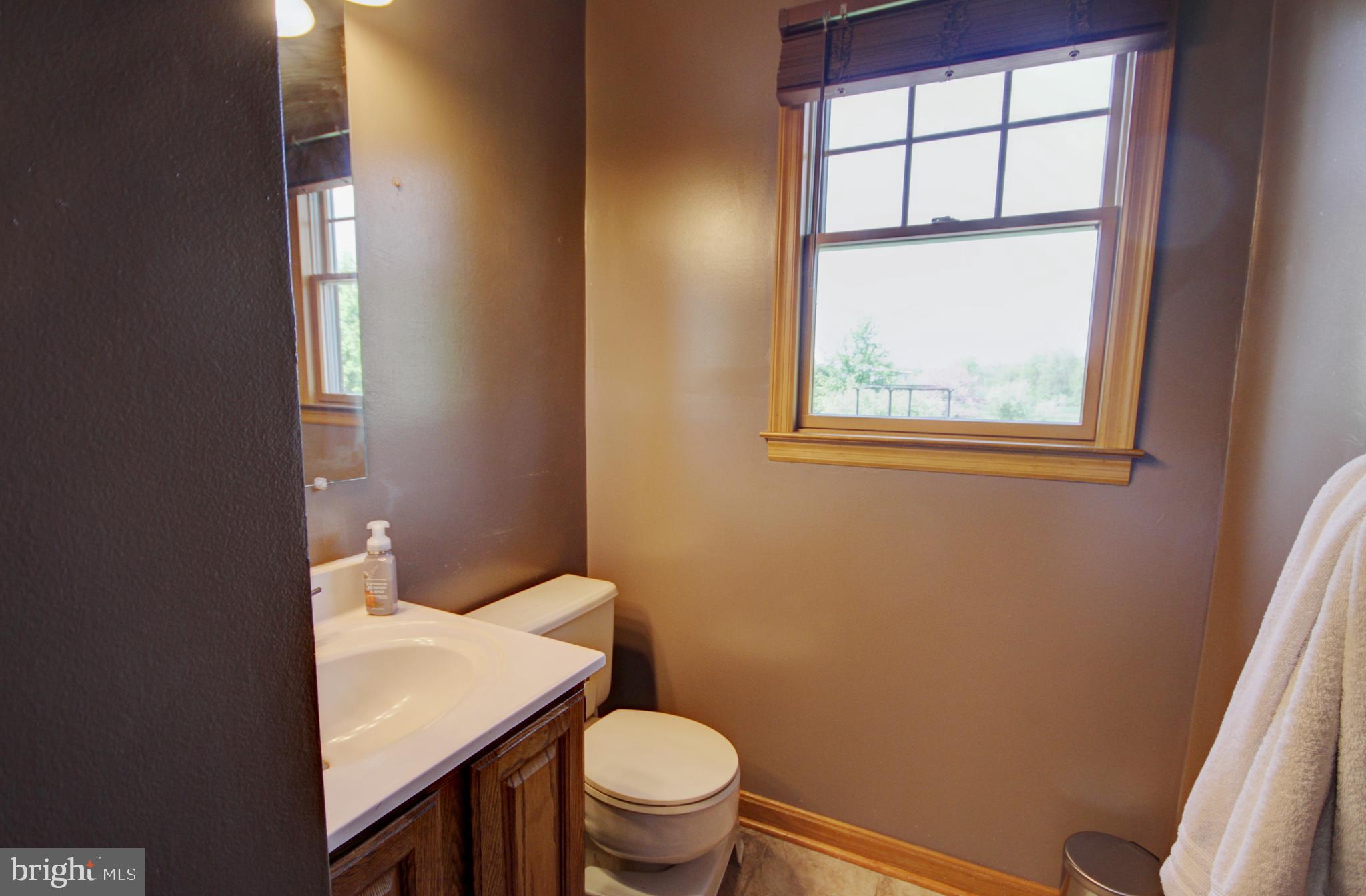215 Hoffecker Road Phoenixville, PA 19460 - Photo 25 of 49 a bathroom with a toilet a sink and a window