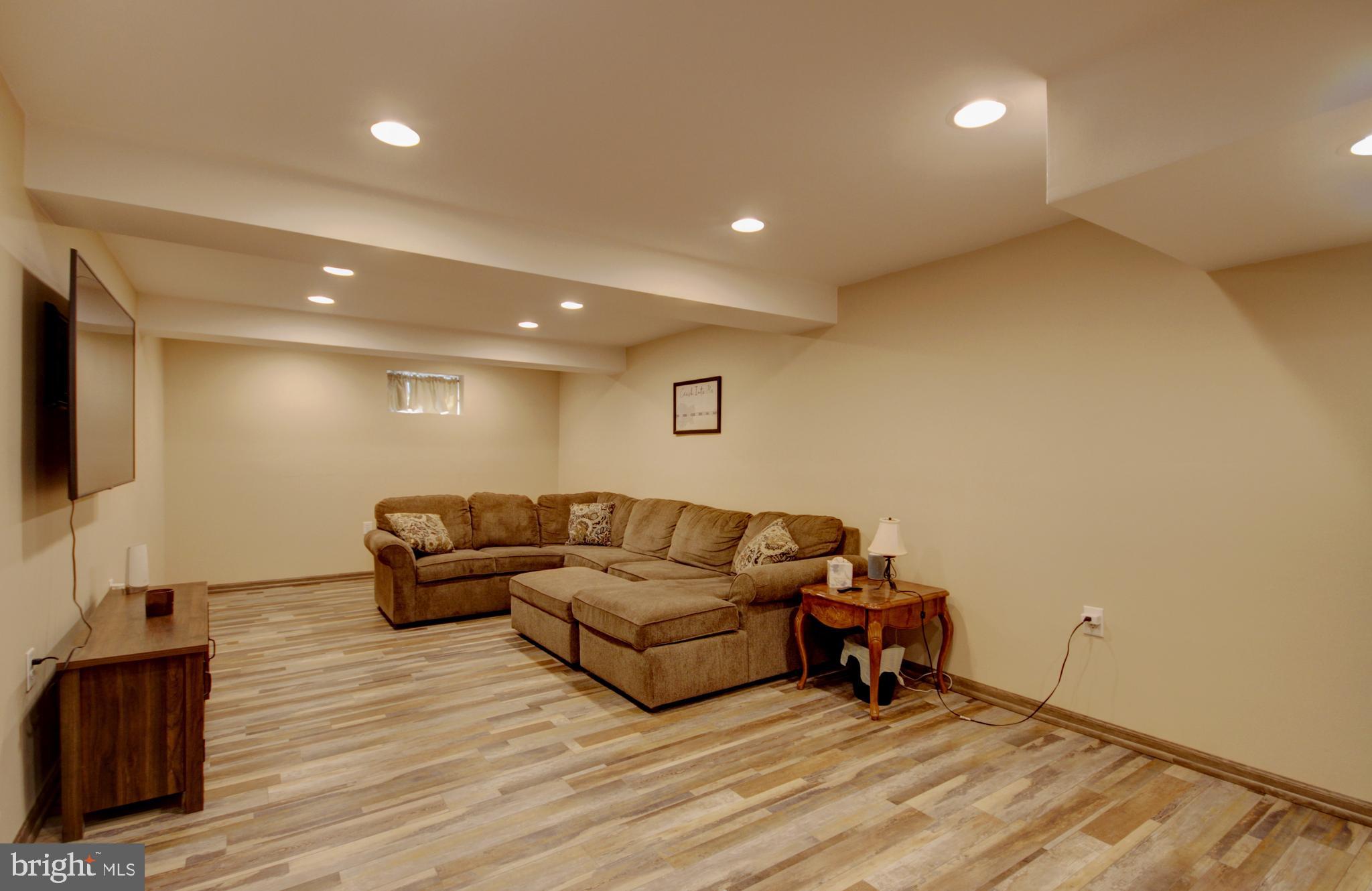 215 Hoffecker Road Phoenixville, PA 19460 - Photo 27 of 49 a living room with furniture and a flat screen tv