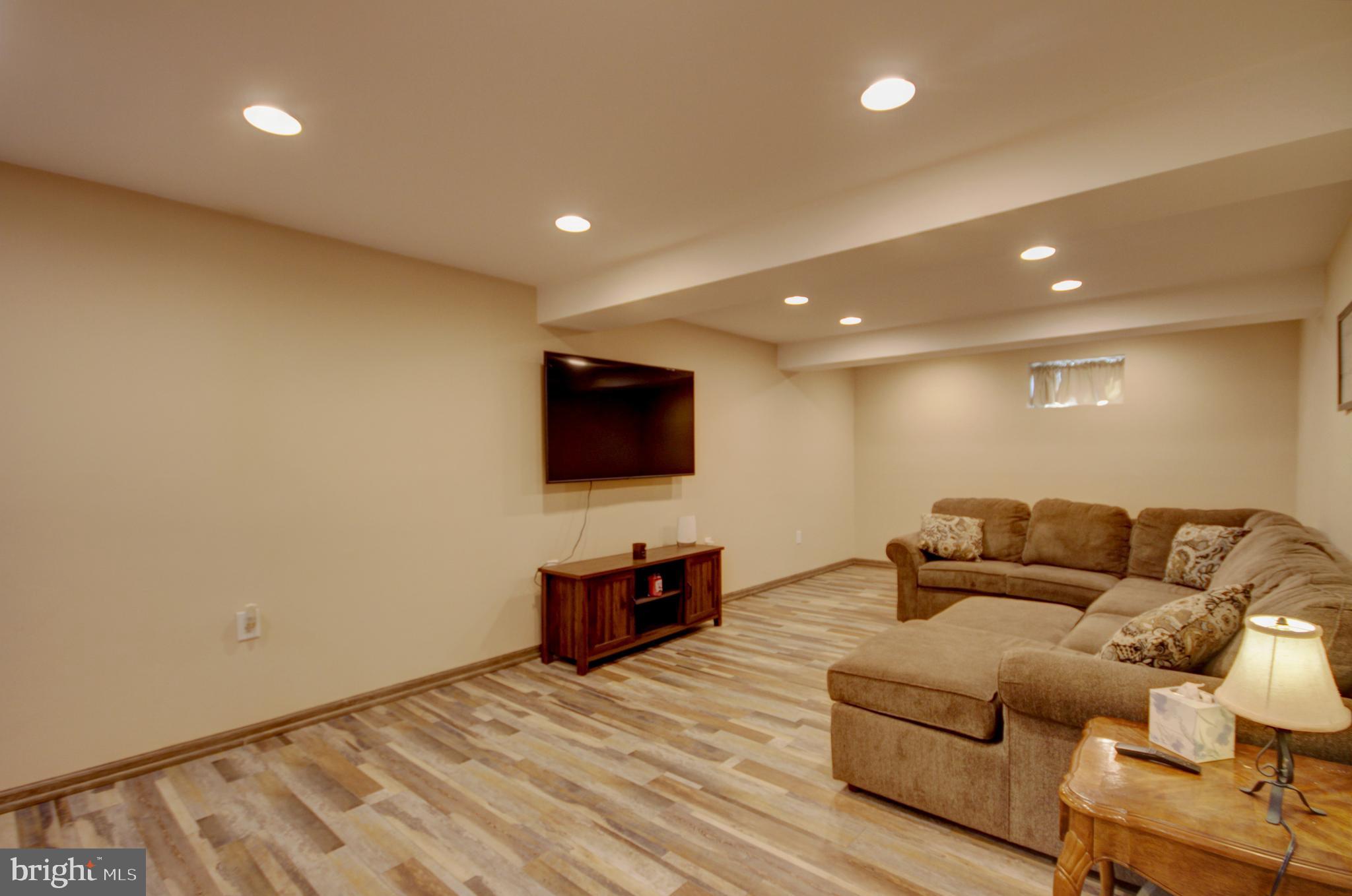 215 Hoffecker Road Phoenixville, PA 19460 - Photo 28 of 49 a living room with furniture and a flat screen tv