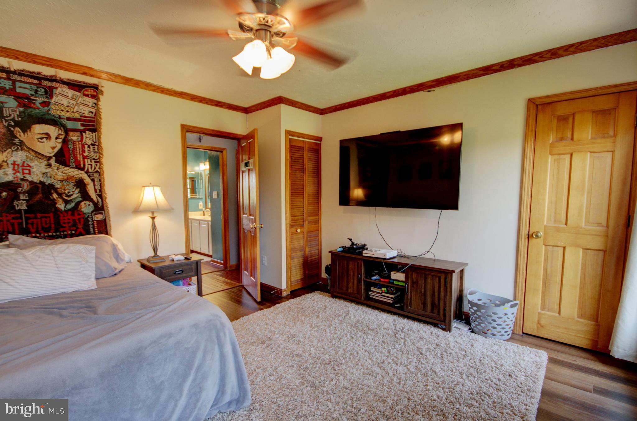 215 Hoffecker Road Phoenixville, PA 19460 - Photo 36 of 49 a bedroom with a bed and a flat tv screen on dresser
