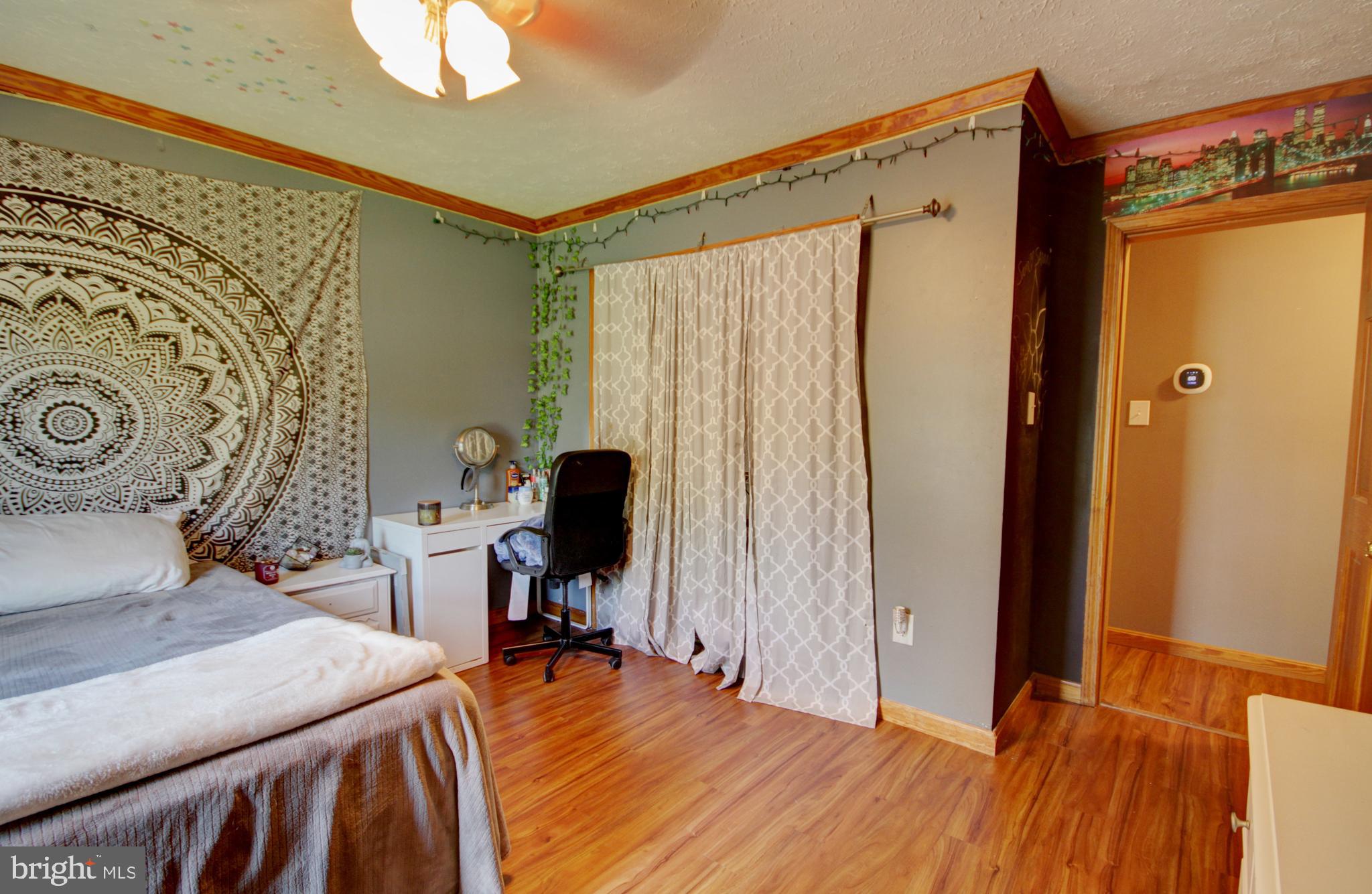 215 Hoffecker Road Phoenixville, PA 19460 - Photo 38 of 49 a bed room with a bed and a chair