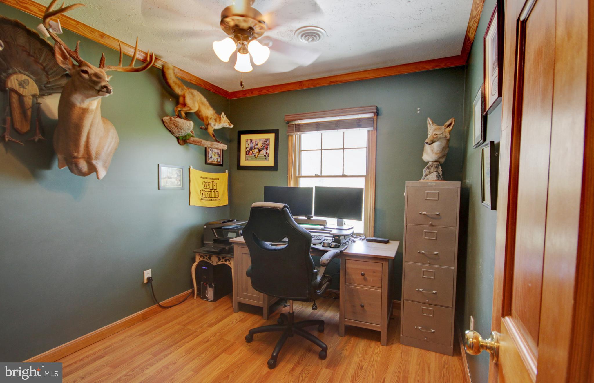 215 Hoffecker Road Phoenixville, PA 19460 - Photo 40 of 49 a view of a workspace with furniture and a window