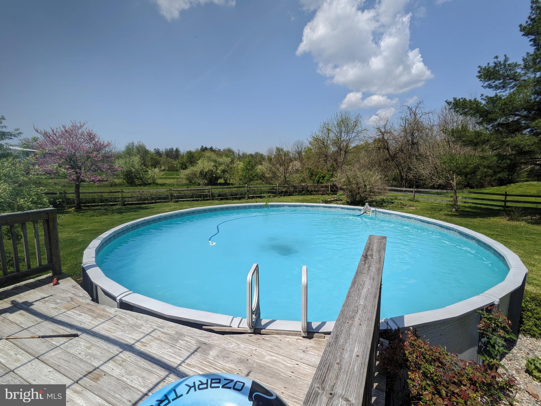 215 Hoffecker Road Phoenixville, PA 19460 - Photo 47 of 49 a view of a swimming pool with a yard and wooden fence