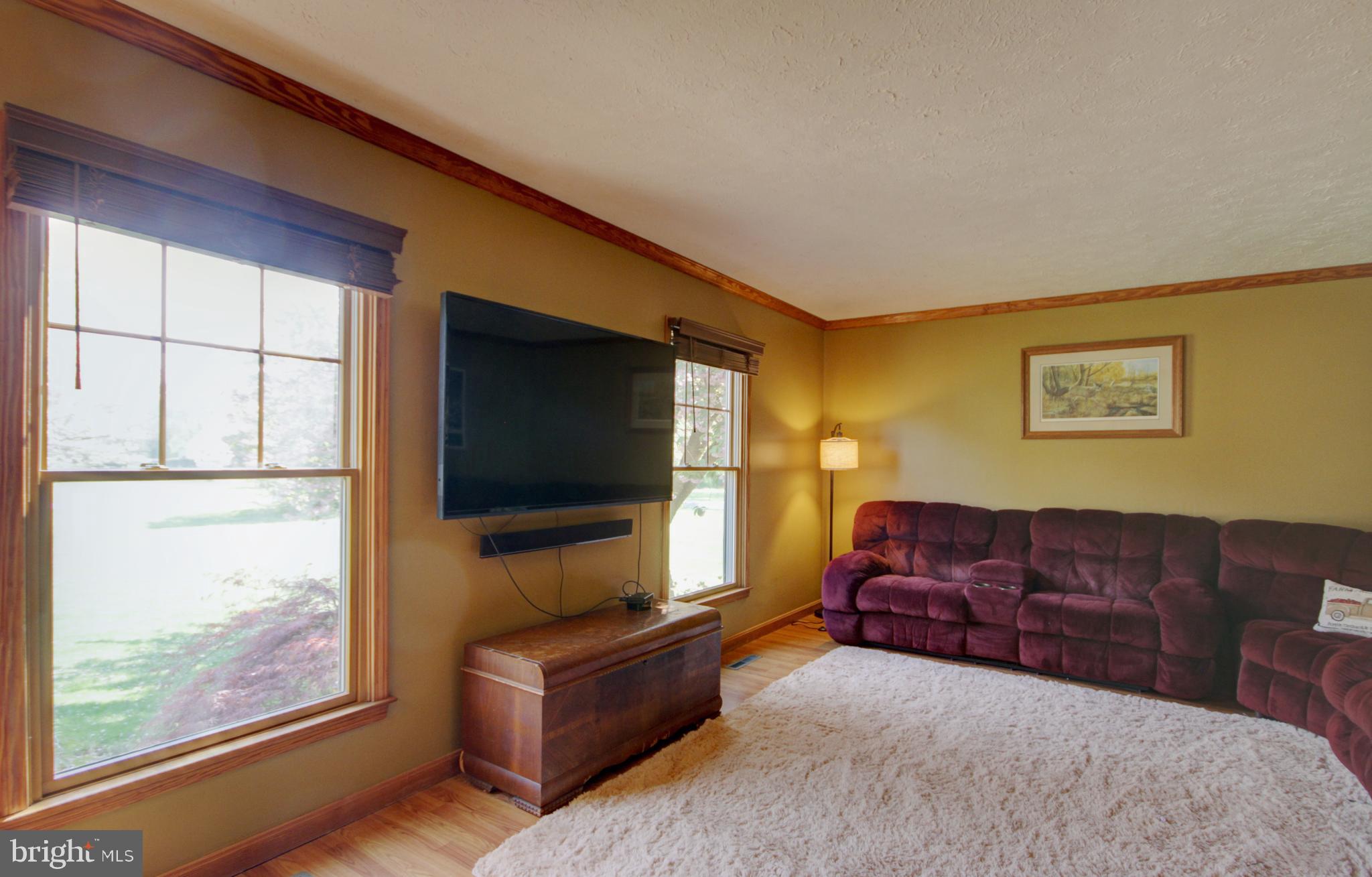 215 Hoffecker Road Phoenixville, PA 19460 - Photo 5 of 49 a living room with furniture and a flat screen tv