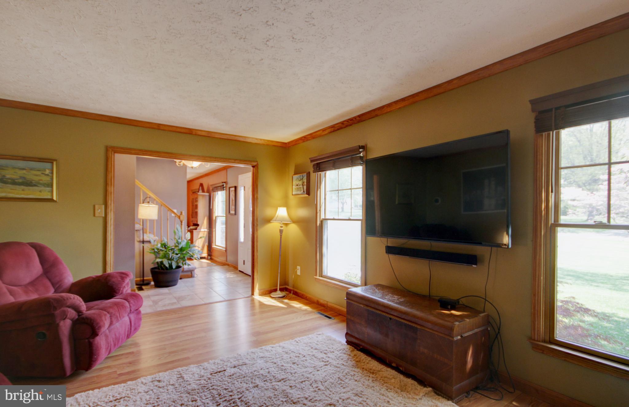 215 Hoffecker Road Phoenixville, PA 19460 - Photo 7 of 49 a living room with furniture and a flat screen tv