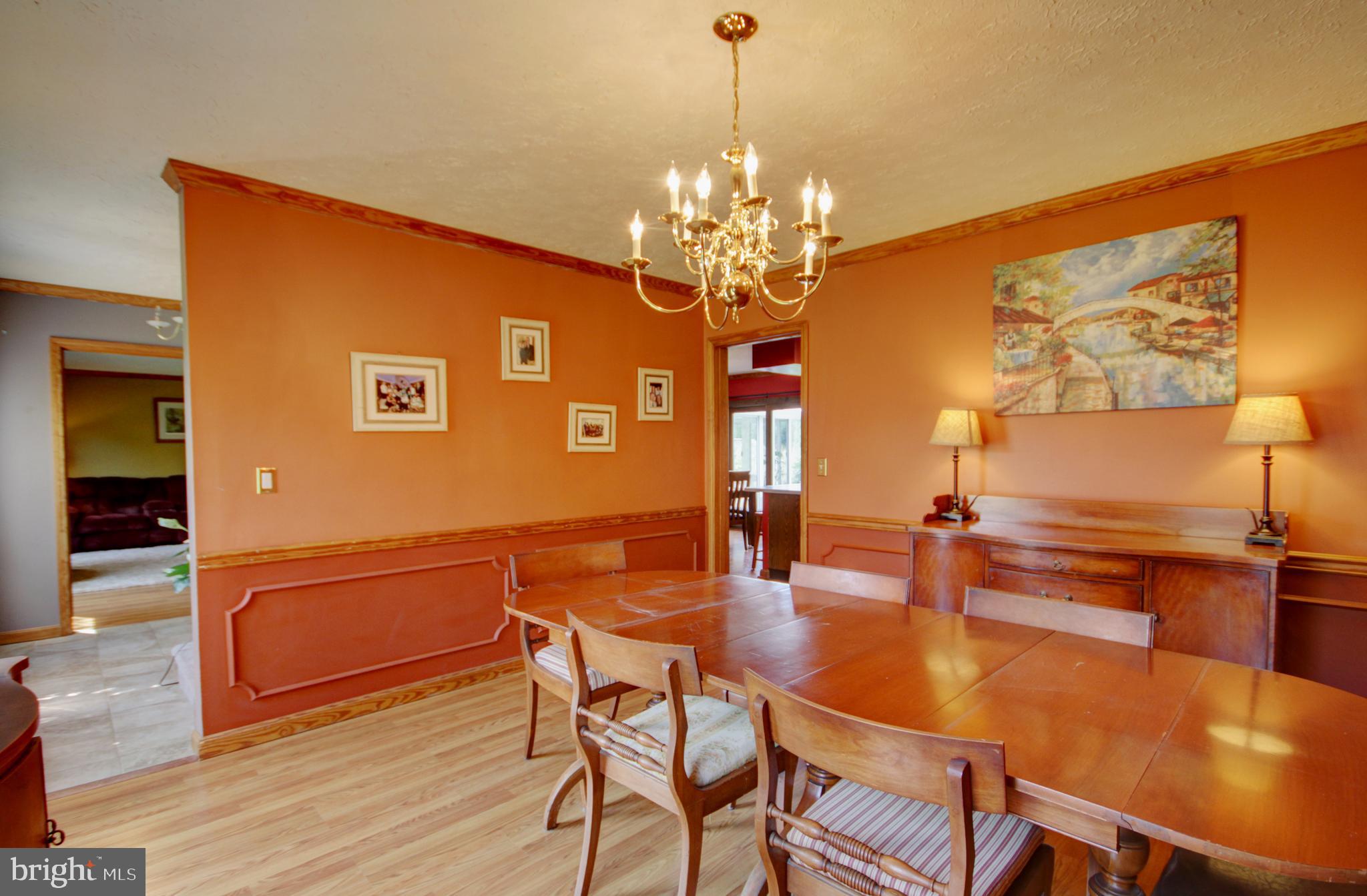 215 Hoffecker Road Phoenixville, PA 19460 - Photo 10 of 49 a dining room with furniture a chandelier and wooden floor