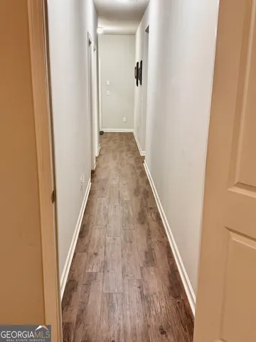 a bathroom with a sink vanity and a toilet