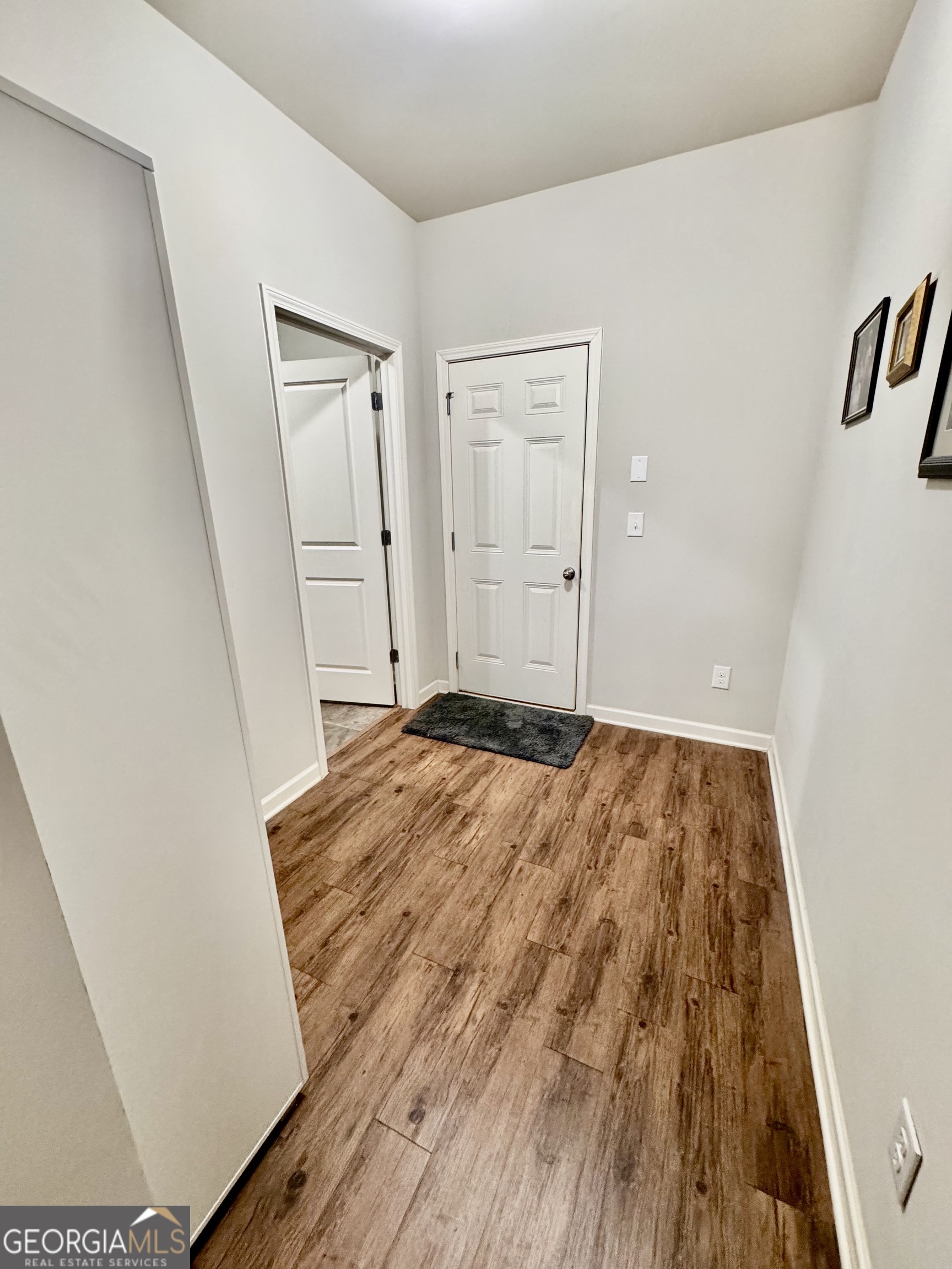 52 Pulaski Avenue Hampton, GA 30228 - Photo 18 of 32 a bedroom with a bed and painting on the wall
