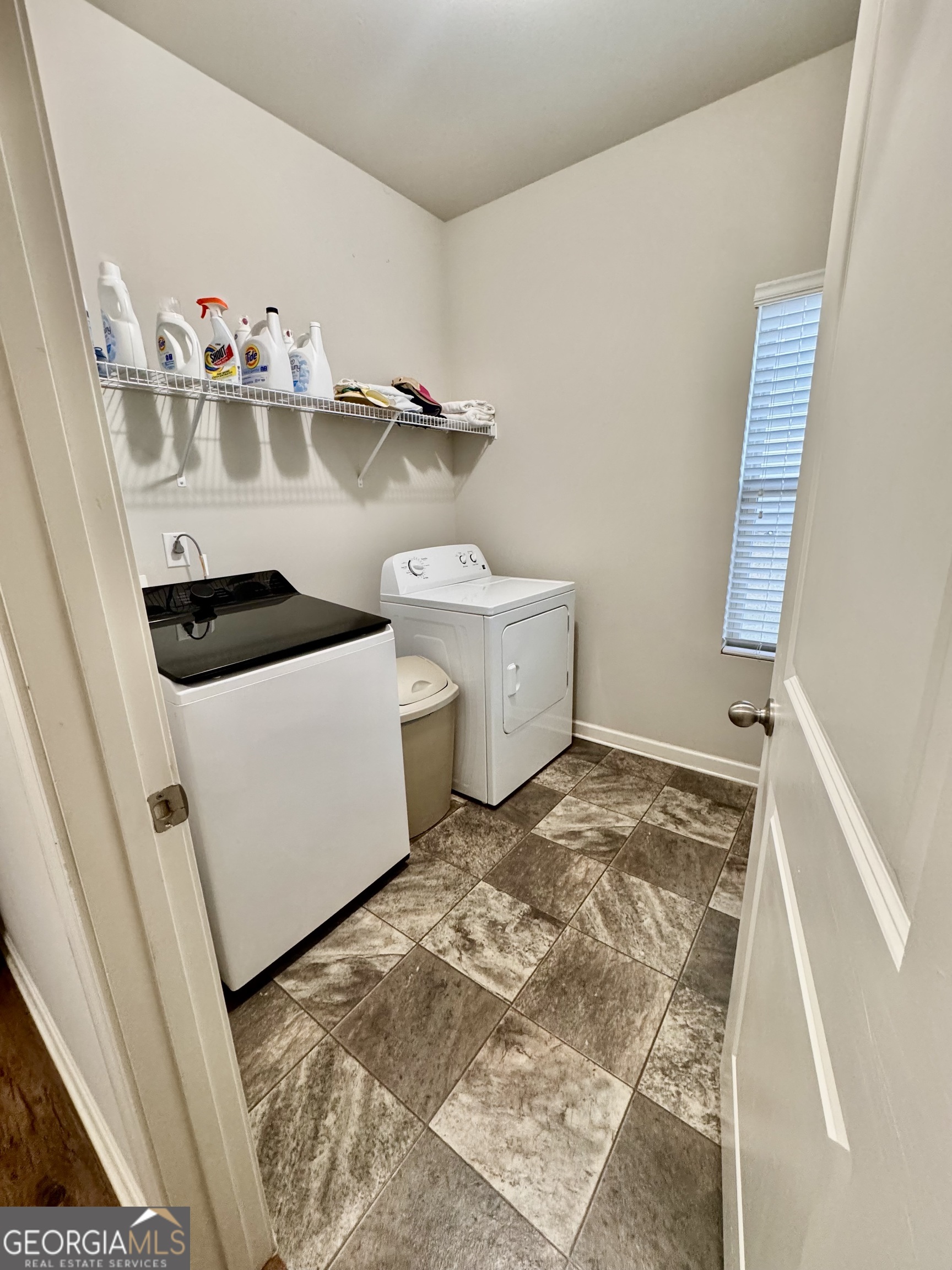 52 Pulaski Avenue Hampton, GA 30228 - Photo 19 of 32 a view of washer and dryer with wooden floor