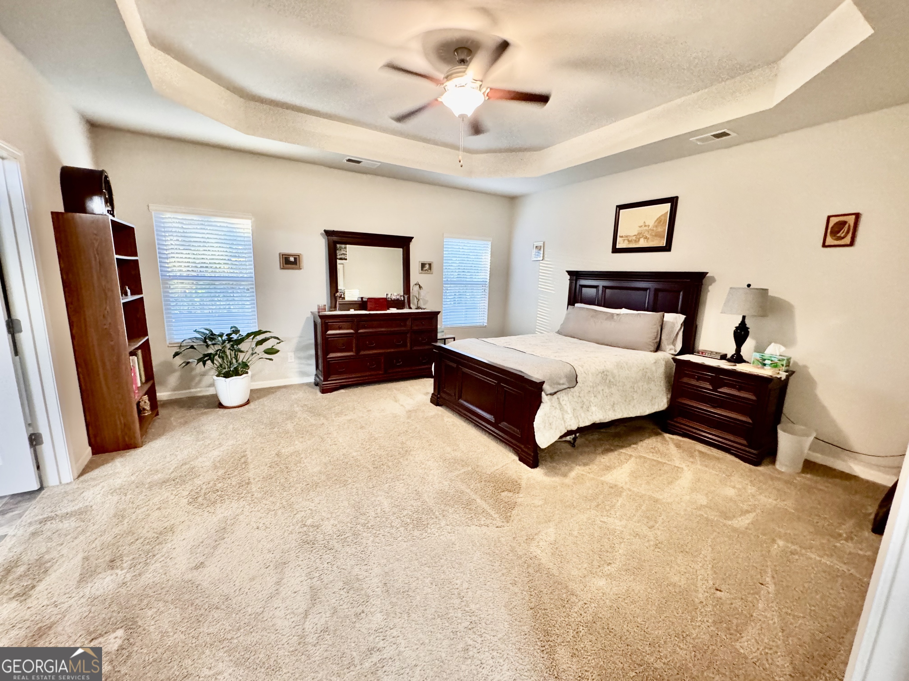 52 Pulaski Avenue Hampton, GA 30228 - Photo 22 of 32 a living room with furniture and a flat screen tv