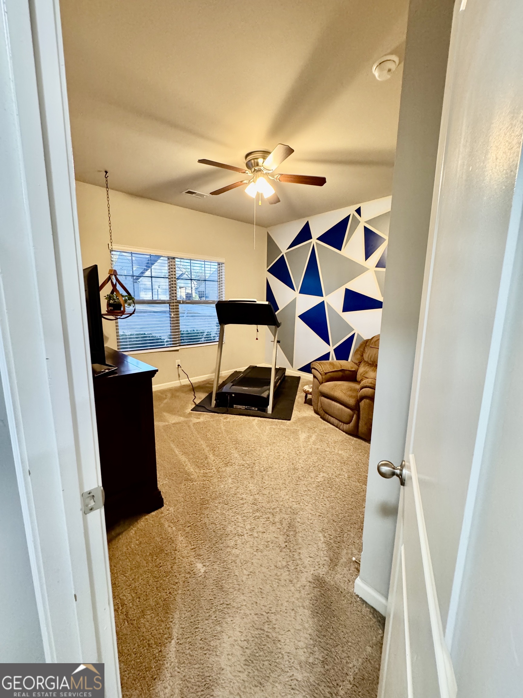 52 Pulaski Avenue Hampton, GA 30228 - Photo 5 of 32 a view of a living room with furniture and a rug