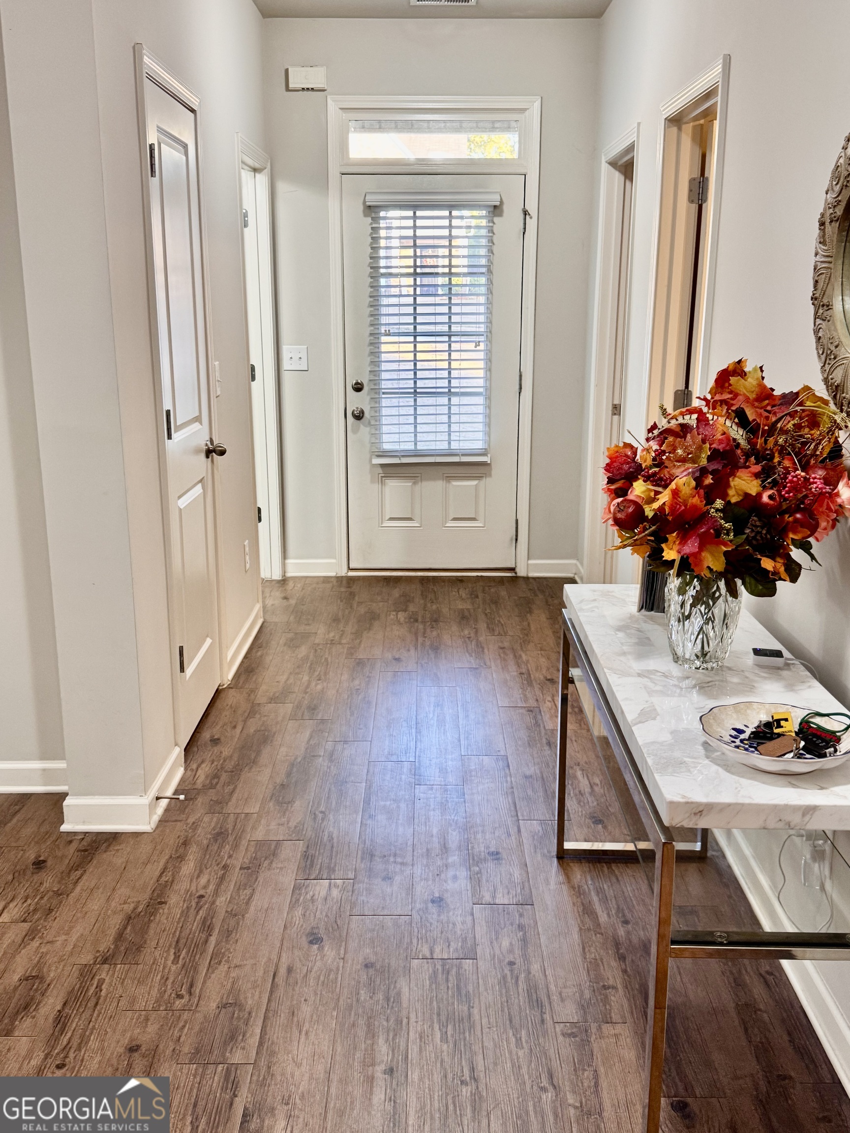 52 Pulaski Avenue Hampton, GA 30228 - Photo 7 of 32 a view of an entryway with wooden floor