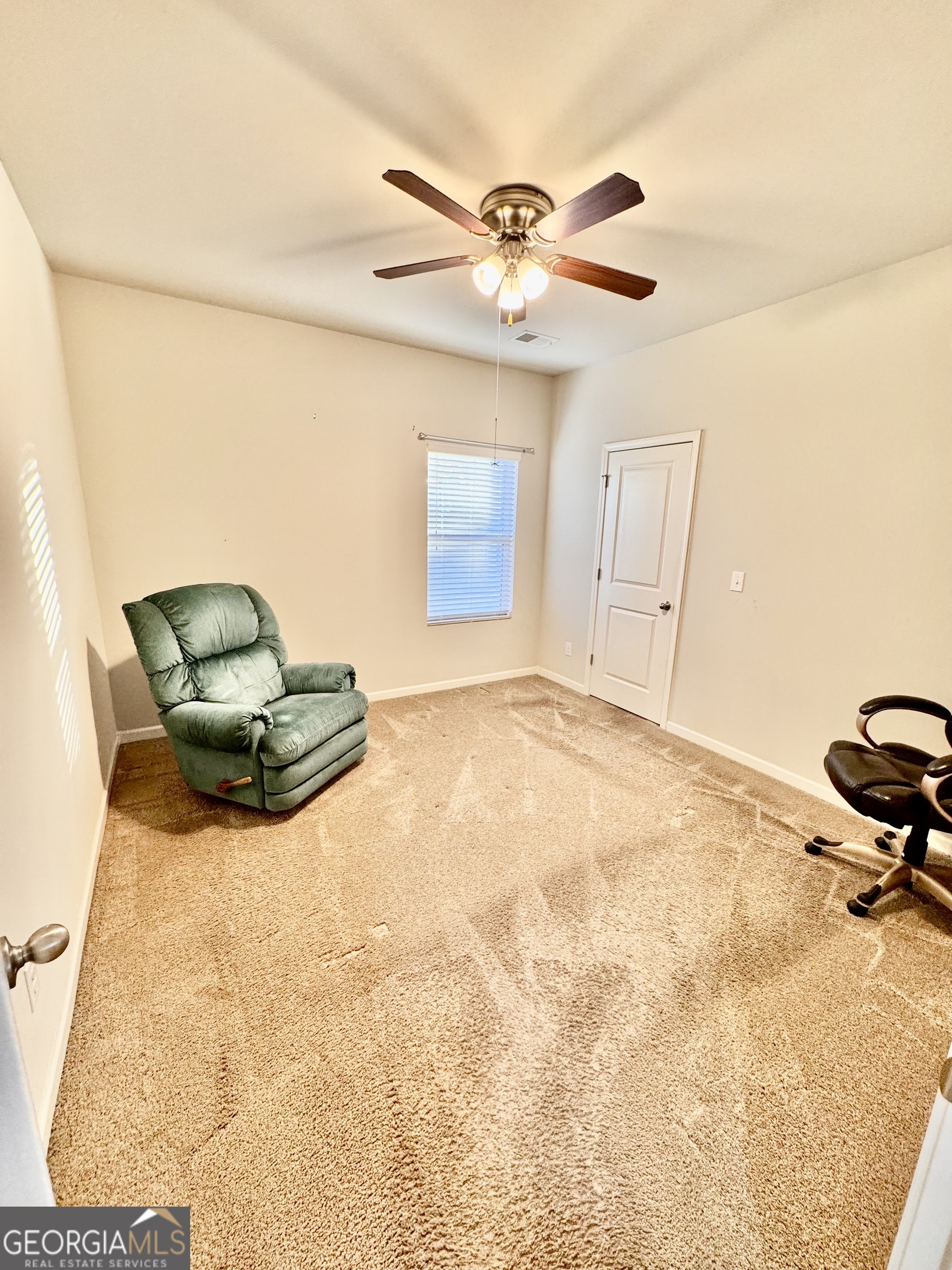 52 Pulaski Avenue Hampton, GA 30228 - Photo 8 of 32 a view of a livingroom with a chandelier furniture and windows