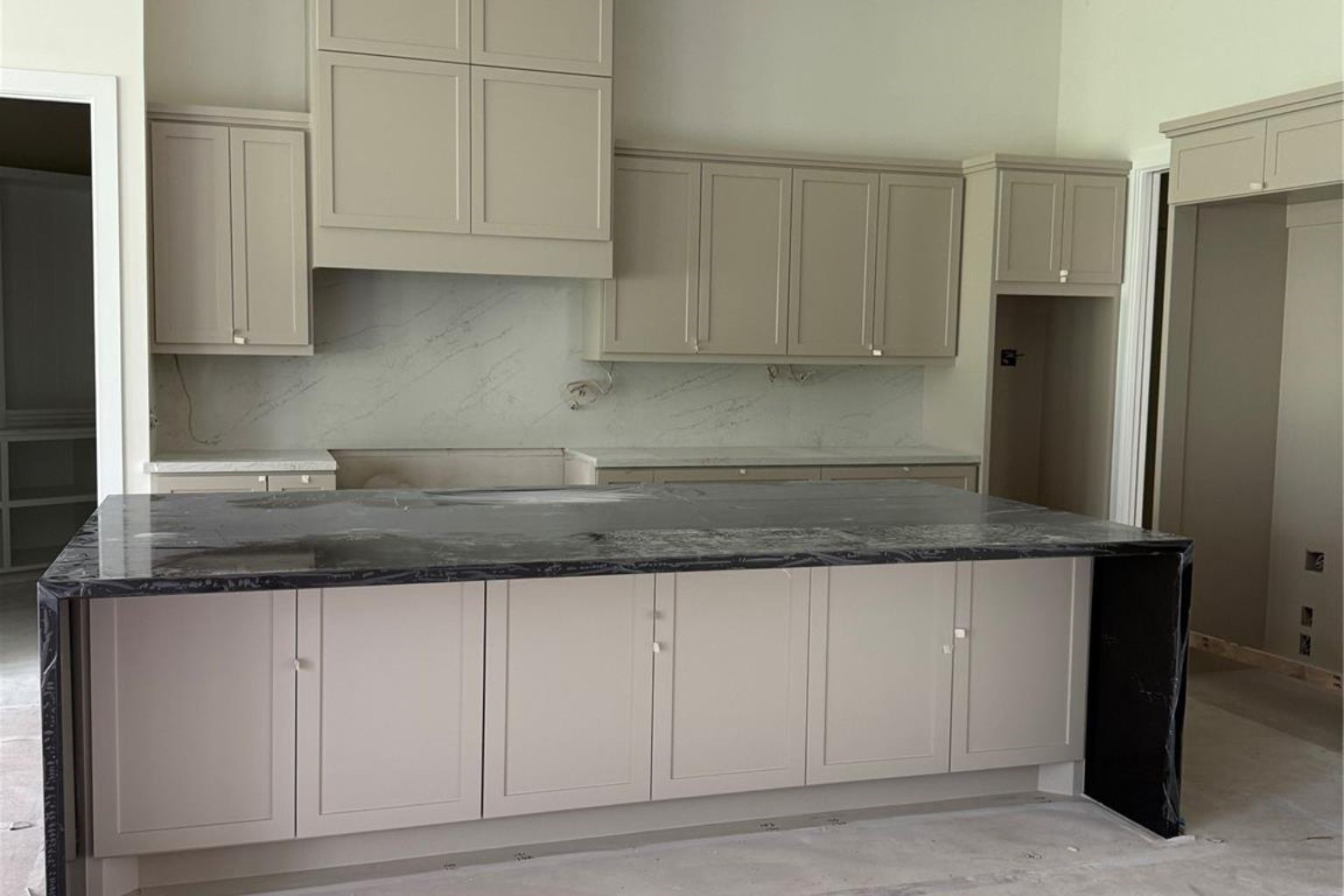 65 Shadow Creek Ridge Drive Spring, TX 77389 - Photo 6 of 44 a kitchen with granite countertop white cabinets and stainless steel appliances