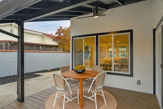 a view of a swimming pool with an outdoor space and seating area