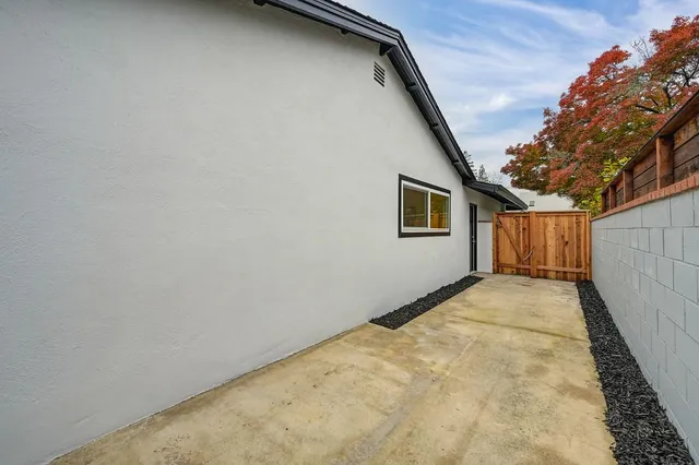 a view of a house with swimming pool and sitting area
