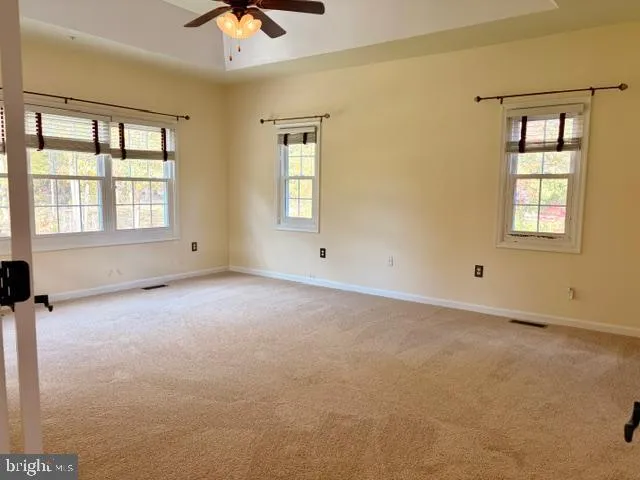 a large bathroom with a glass door shower and sink