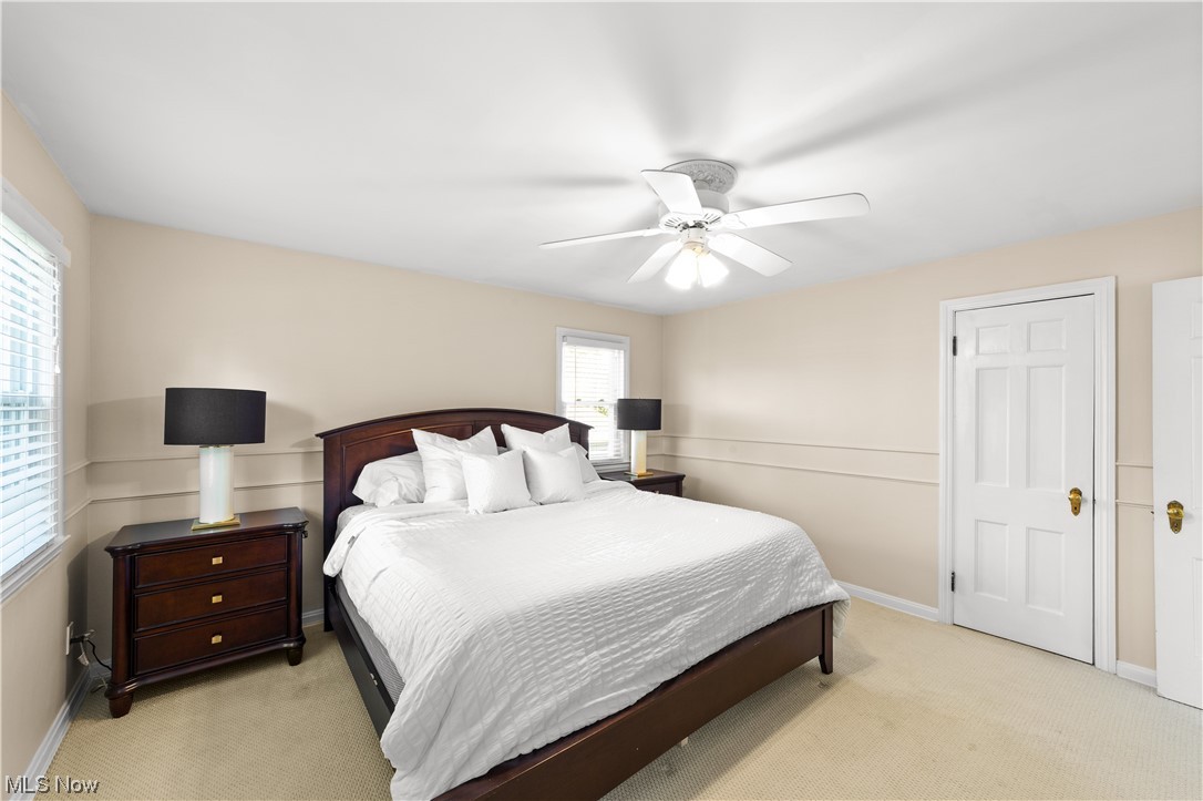 15722 Munn Road Cleveland, OH 44111 - Photo 14 of 32 Bedroom with light carpet and ceiling fan