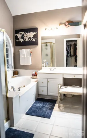a view of a patio with couches chairs and wooden floor