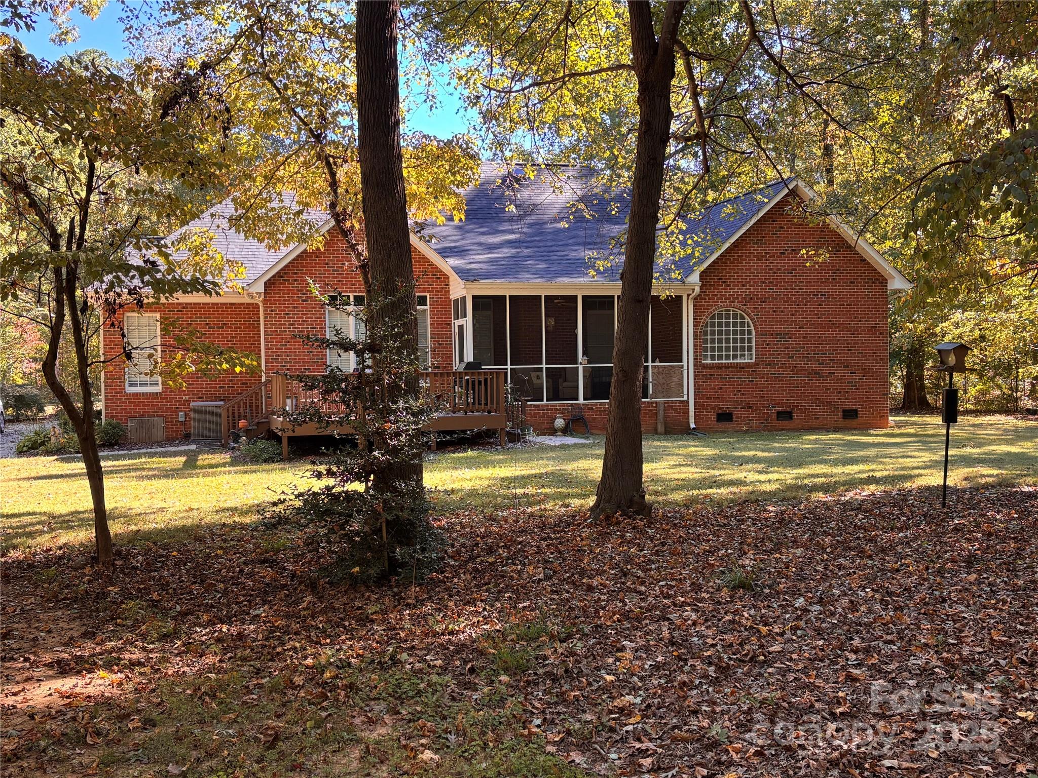 12350 Hartwood Road Midland, NC 28107 - Photo 23 of 25 a view of a house with backyard and tree