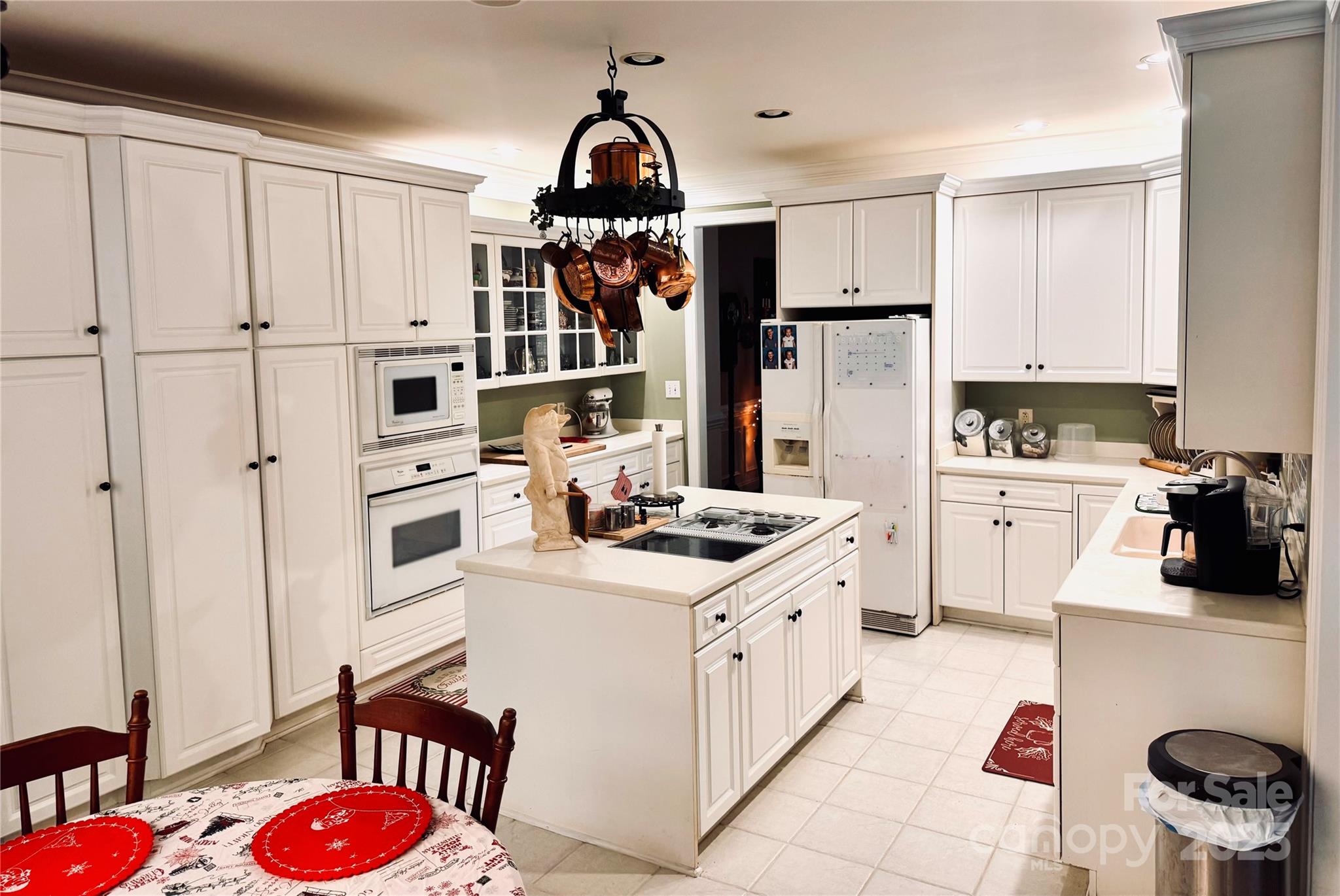 12350 Hartwood Road Midland, NC 28107 - Photo 5 of 25 a kitchen with granite countertop a white stove top oven sink and cabinets