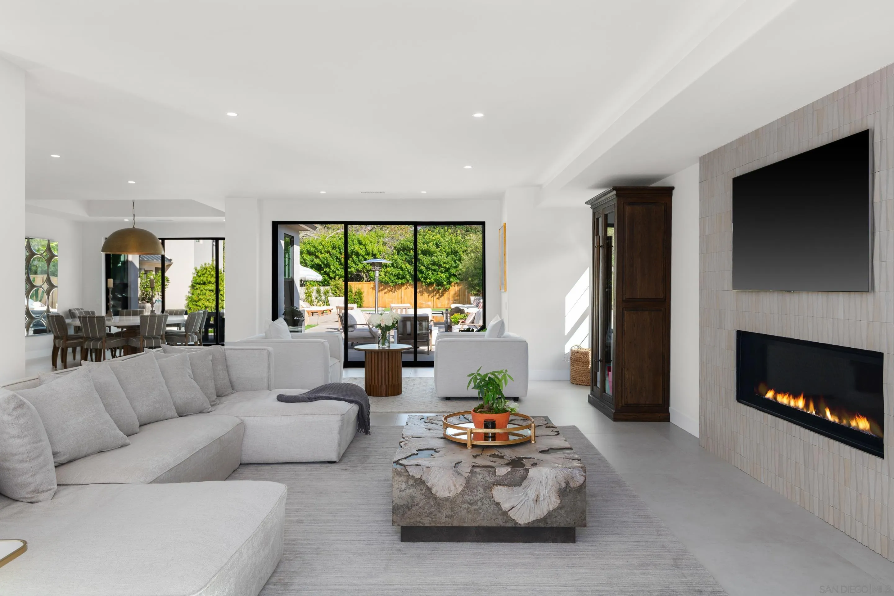 6665 Via Estrada La Jolla, CA 92037 - Photo 12 of 59 a living room with furniture and a fireplace