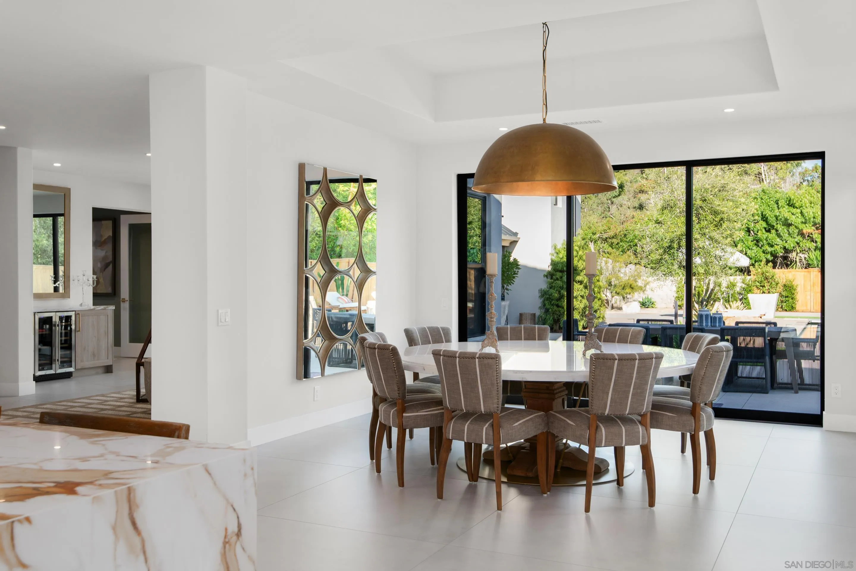 6665 Via Estrada La Jolla, CA 92037 - Photo 14 of 59 a dining room with furniture window wooden floor