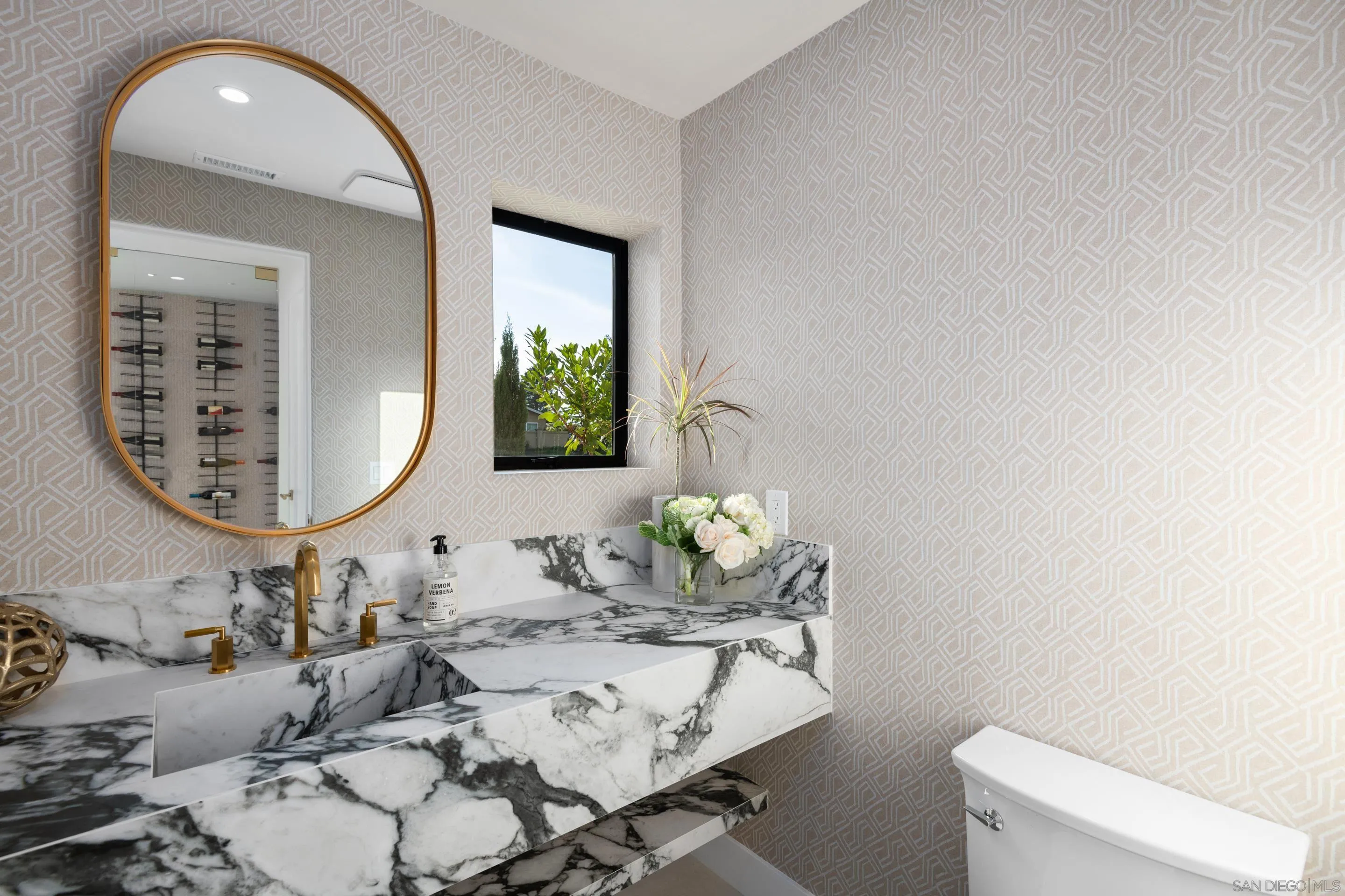 6665 Via Estrada La Jolla, CA 92037 - Photo 19 of 59 a bathroom with a granite countertop sink and a mirror