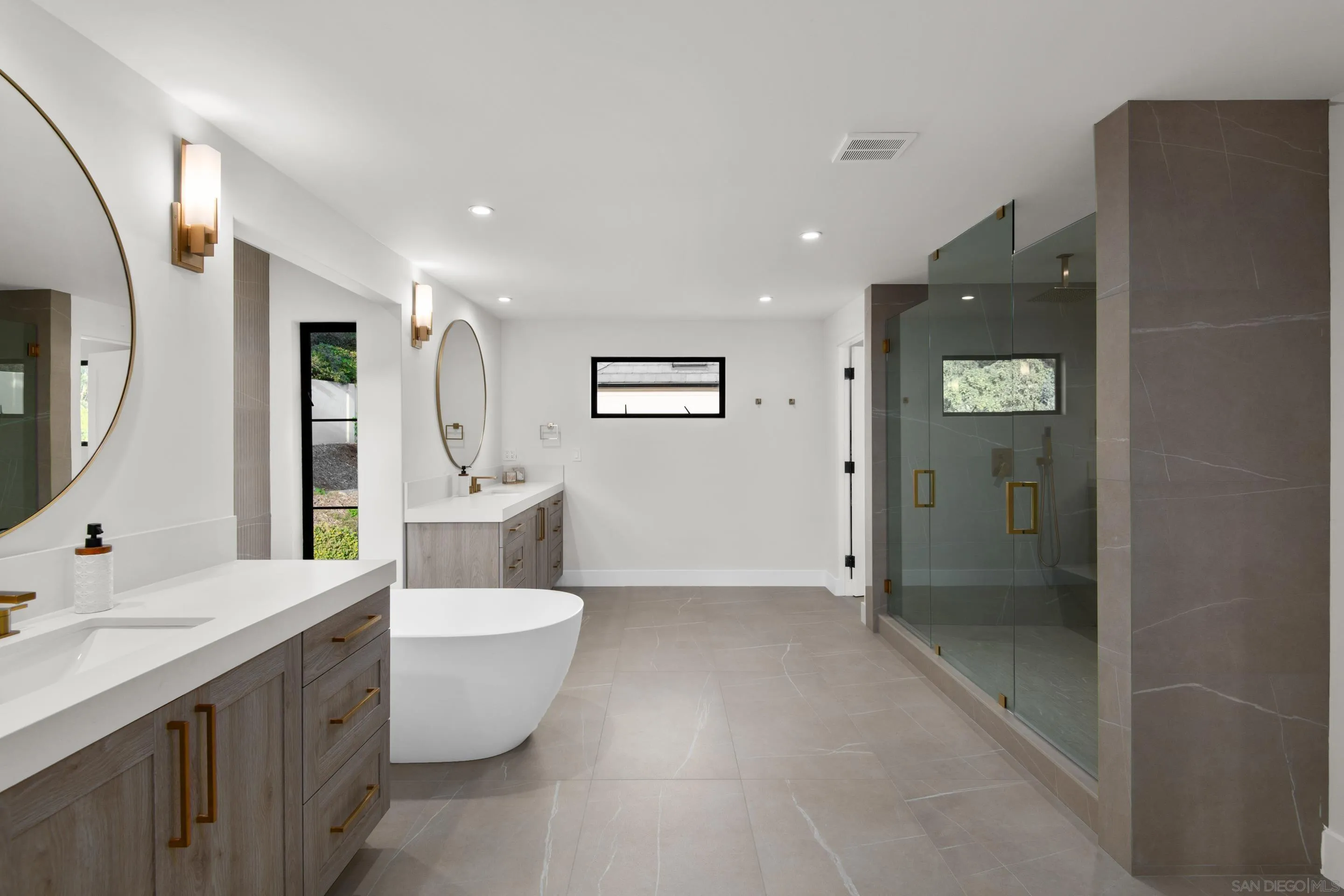 6665 Via Estrada La Jolla, CA 92037 - Photo 21 of 59 a bathroom with a toilet sink and mirror