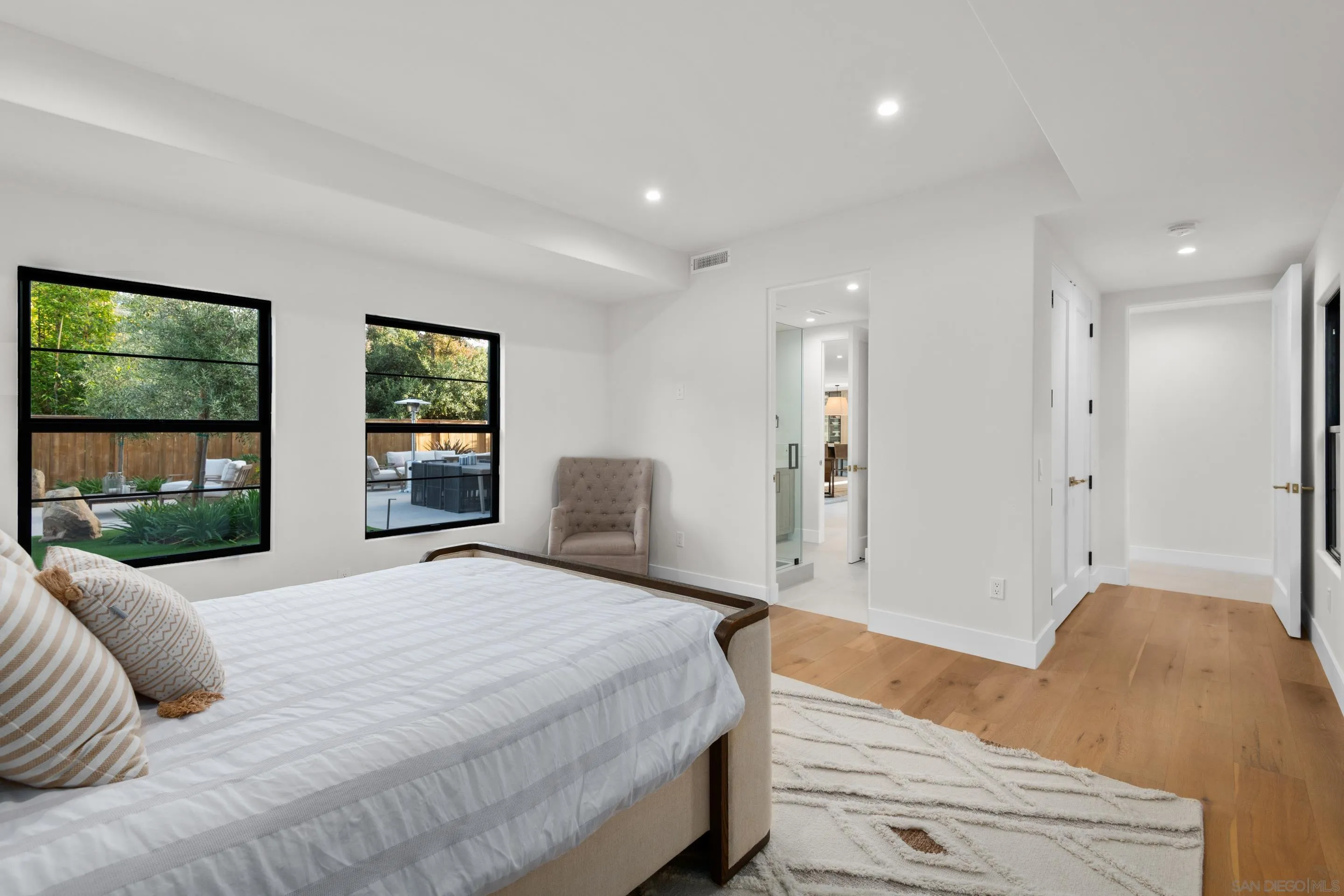 6665 Via Estrada La Jolla, CA 92037 - Photo 30 of 59 a bedroom with a large bed and a window