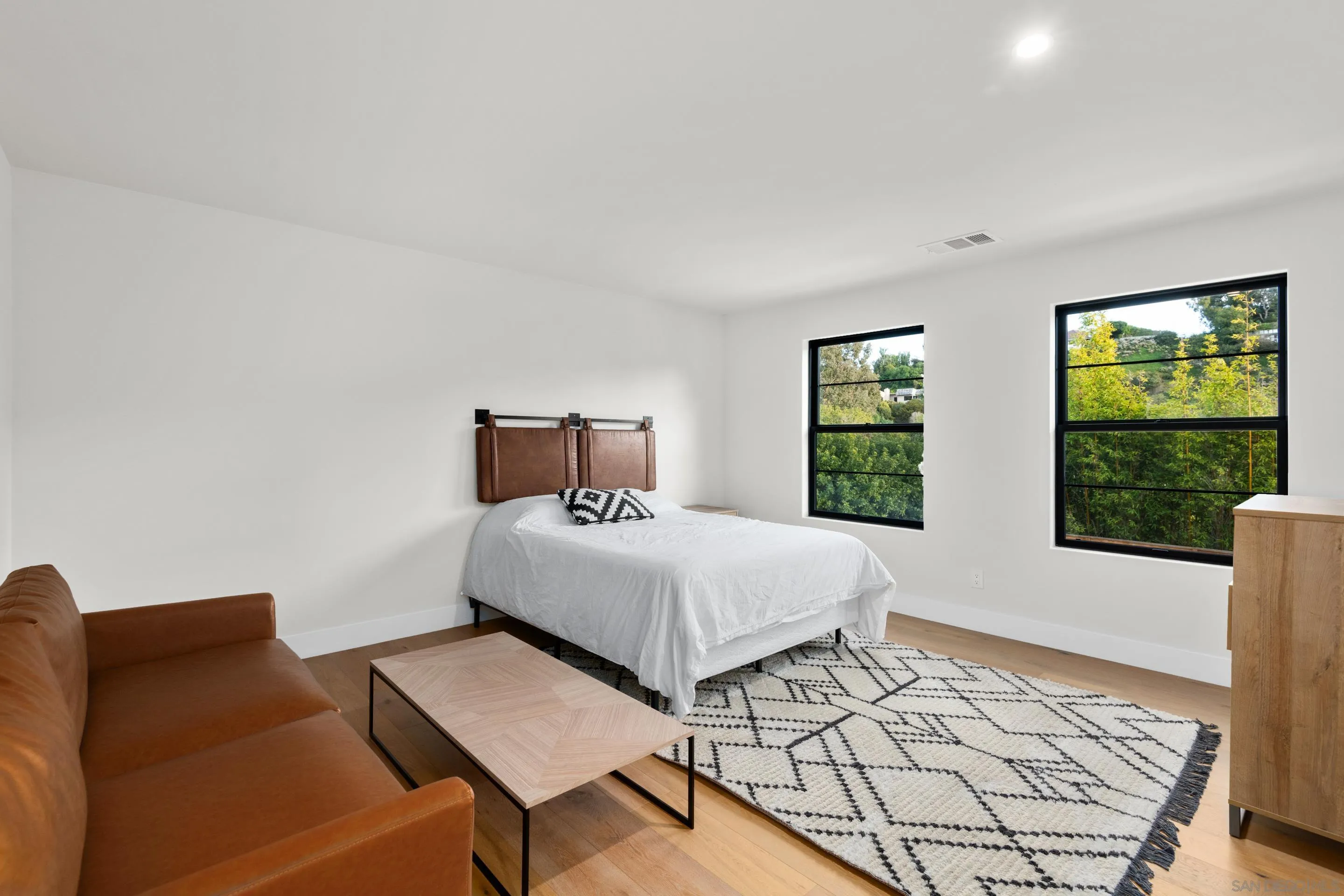 6665 Via Estrada La Jolla, CA 92037 - Photo 33 of 59 a bedroom with a bed window and a table