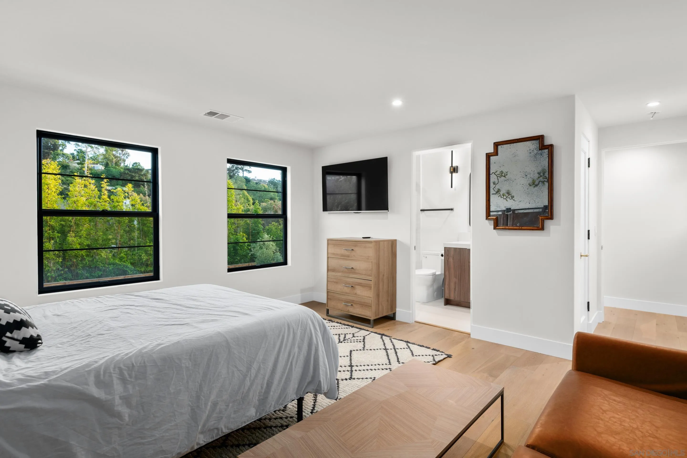 6665 Via Estrada La Jolla, CA 92037 - Photo 34 of 59 a bedroom with a bed a couch and dresser