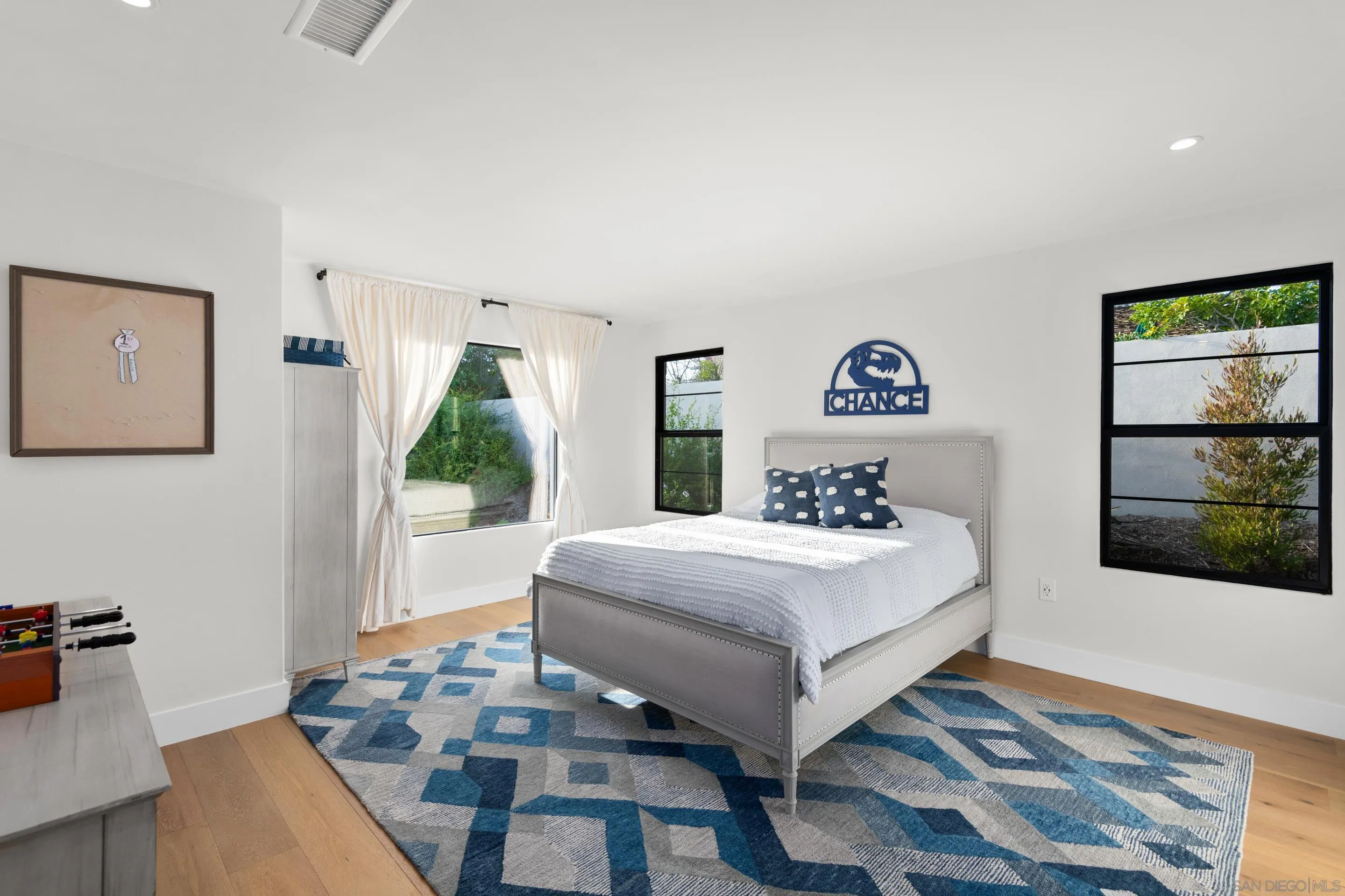 6665 Via Estrada La Jolla, CA 92037 - Photo 44 of 59 a bedroom with a bed and a table in it