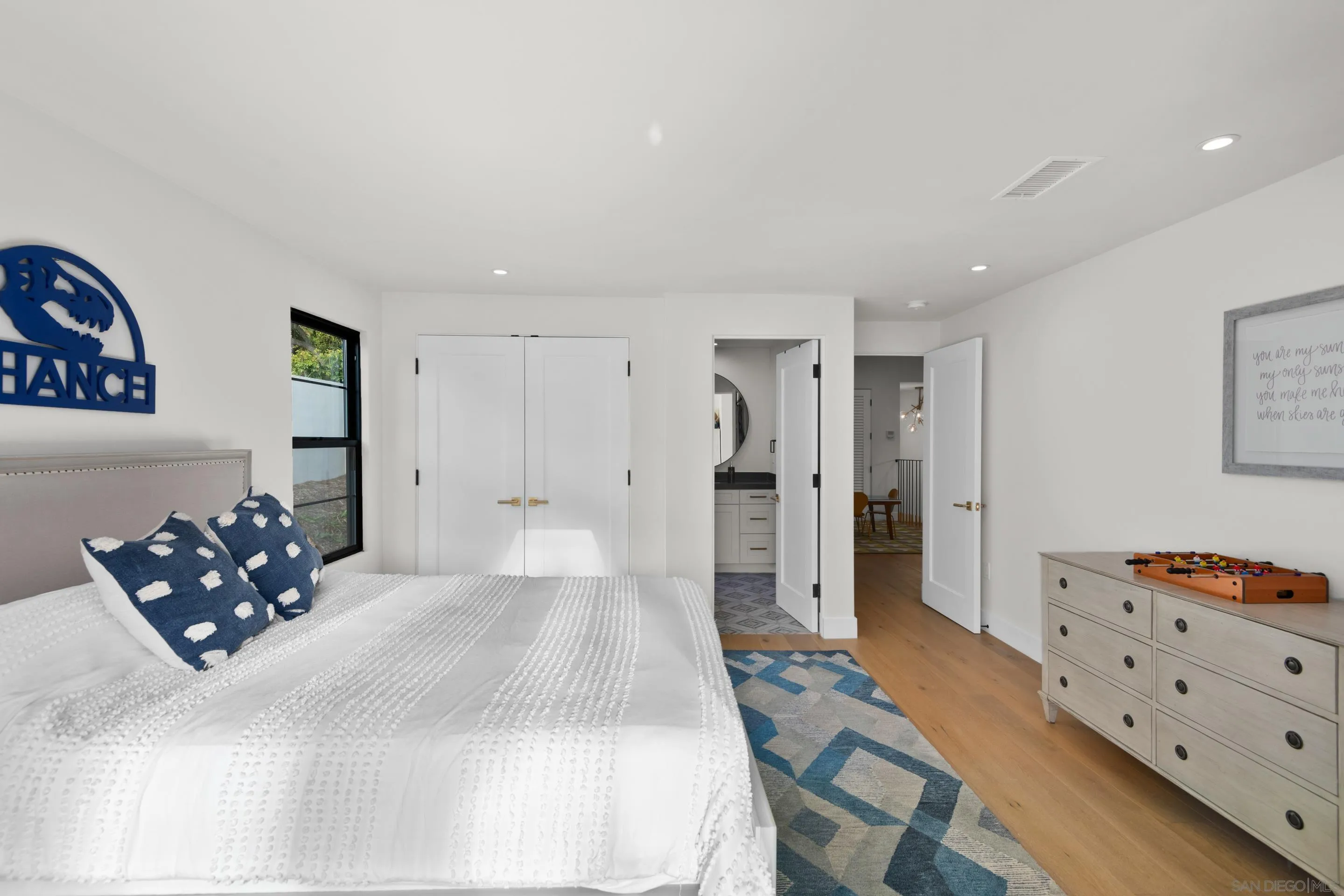 6665 Via Estrada La Jolla, CA 92037 - Photo 45 of 59 a bedroom with a bed and a dresser