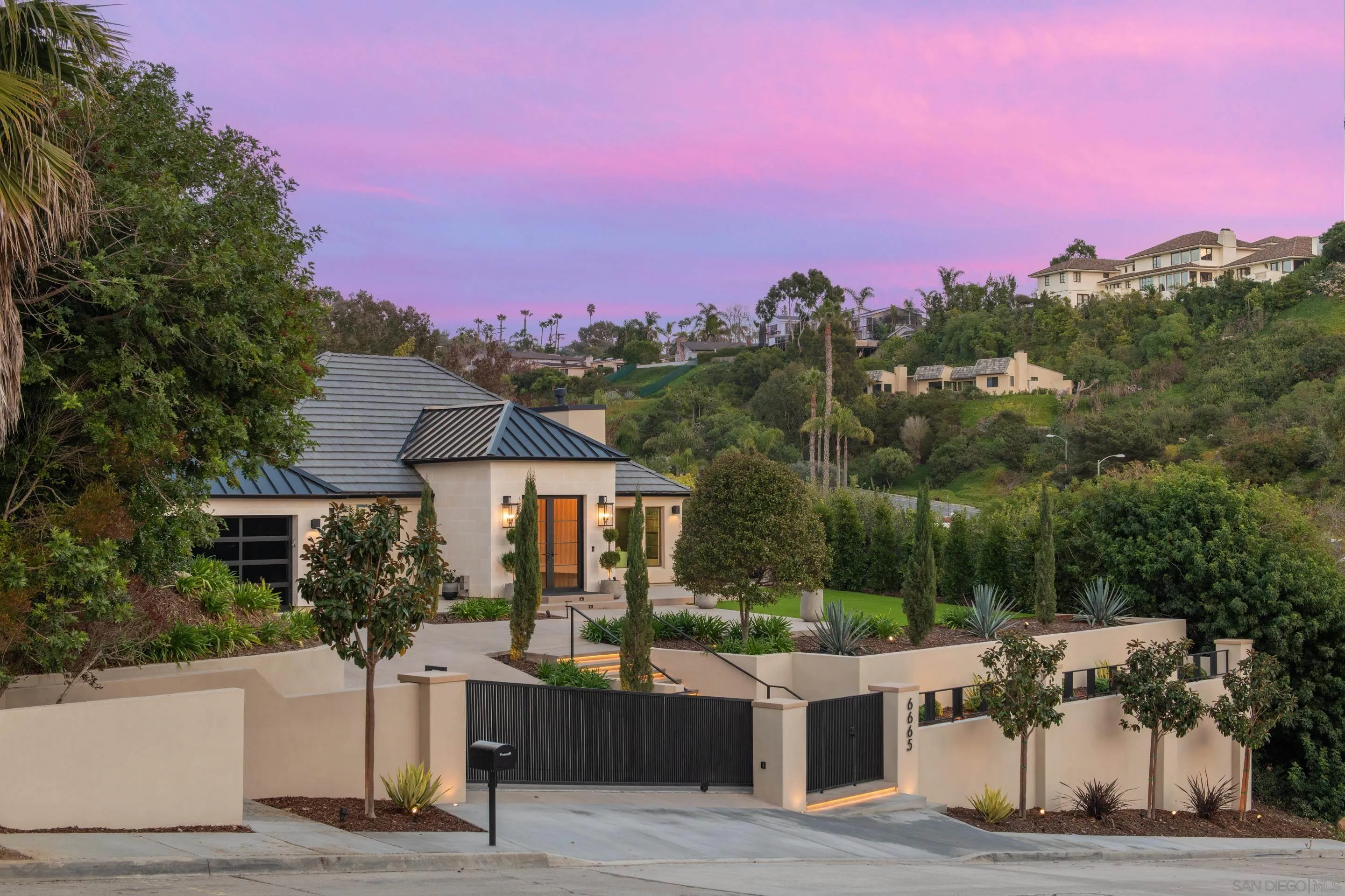 6665 Via Estrada La Jolla, CA 92037 - Photo 54 of 59 a front view of a house with a yard and mountain view
