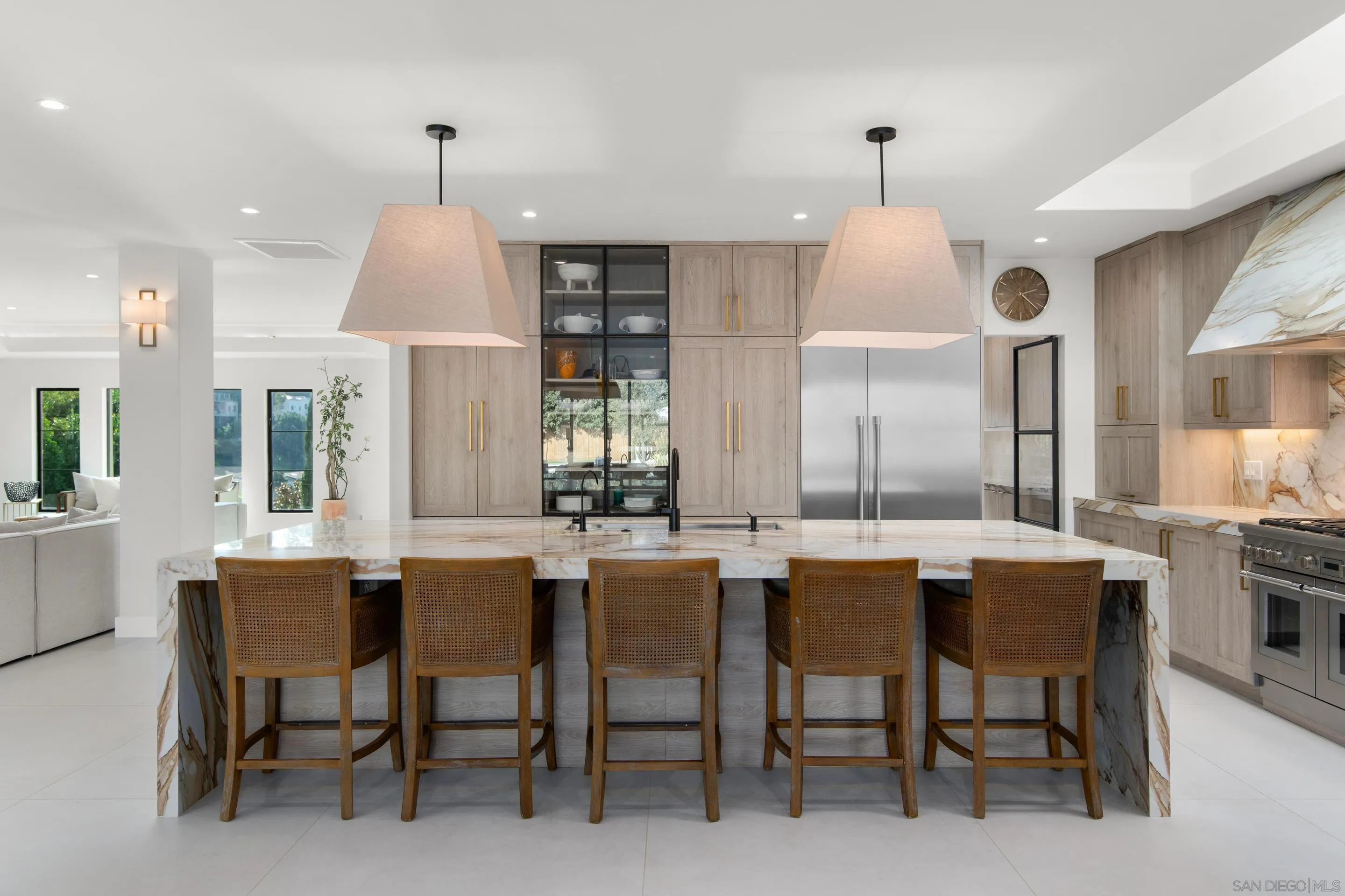 6665 Via Estrada La Jolla, CA 92037 - Photo 7 of 59 a dining room with furniture a chandelier and kitchen view