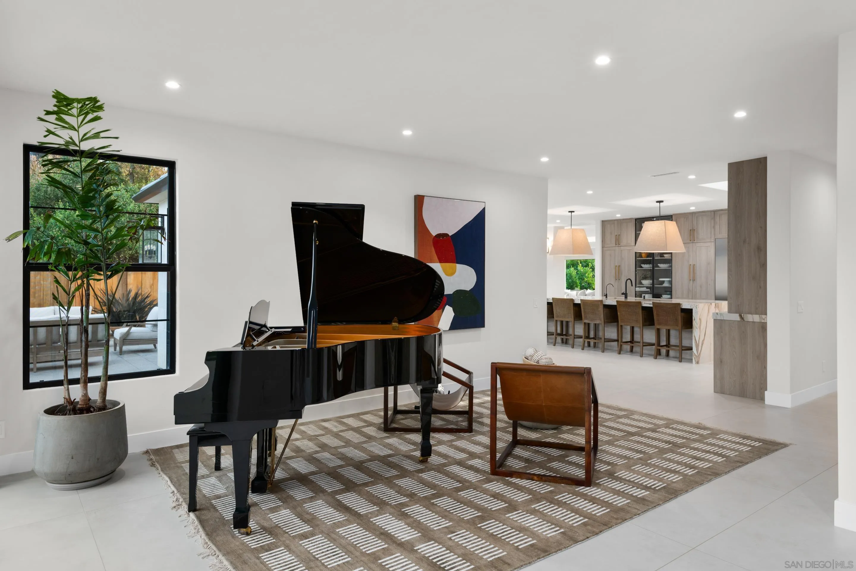 6665 Via Estrada La Jolla, CA 92037 - Photo 9 of 59 a living room with furniture and a flat screen tv