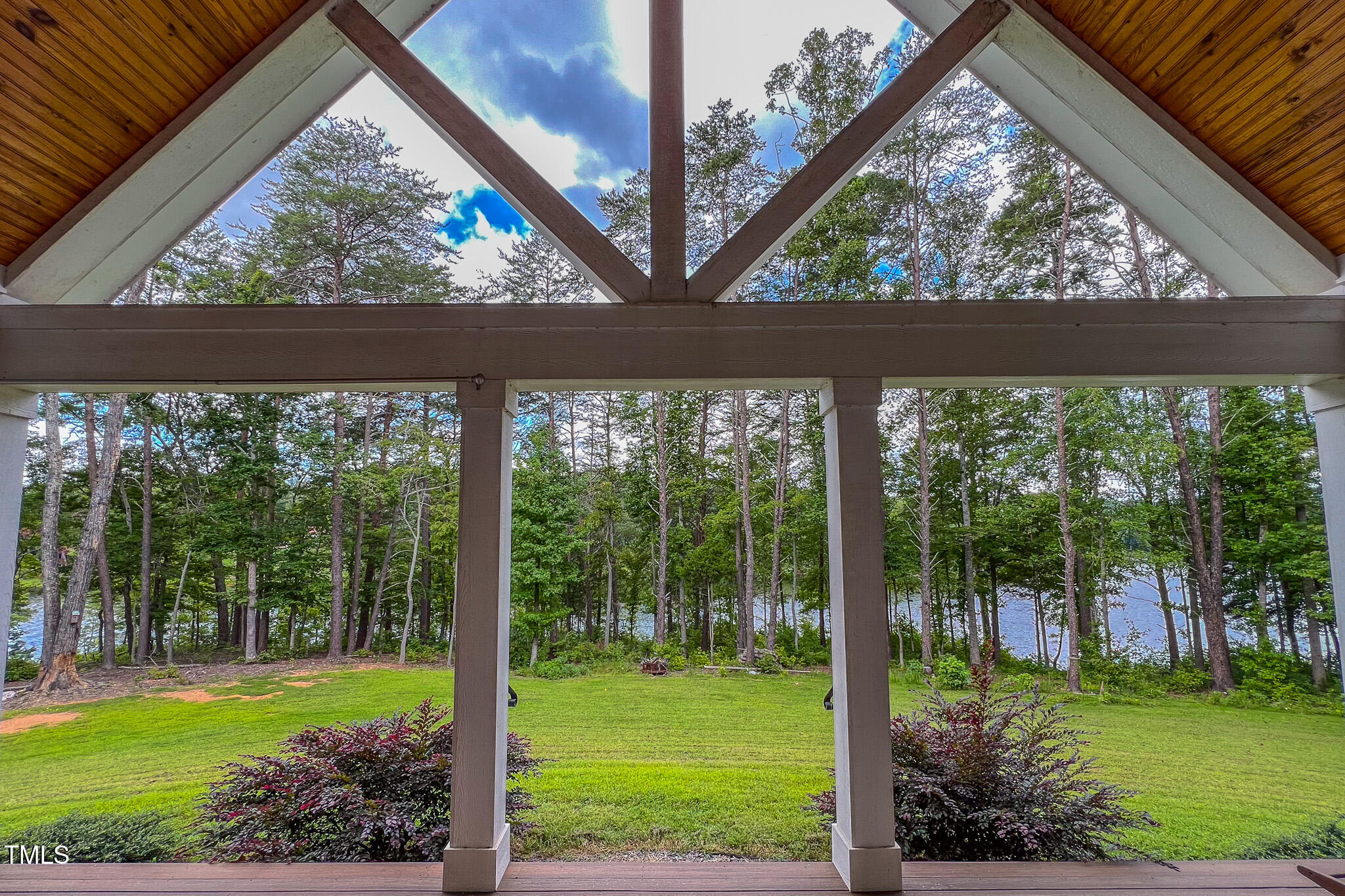 355 Fishermans Point Road Roxboro, NC 27574 - Photo 20 of 70 a view of a backyard with a garden and plants