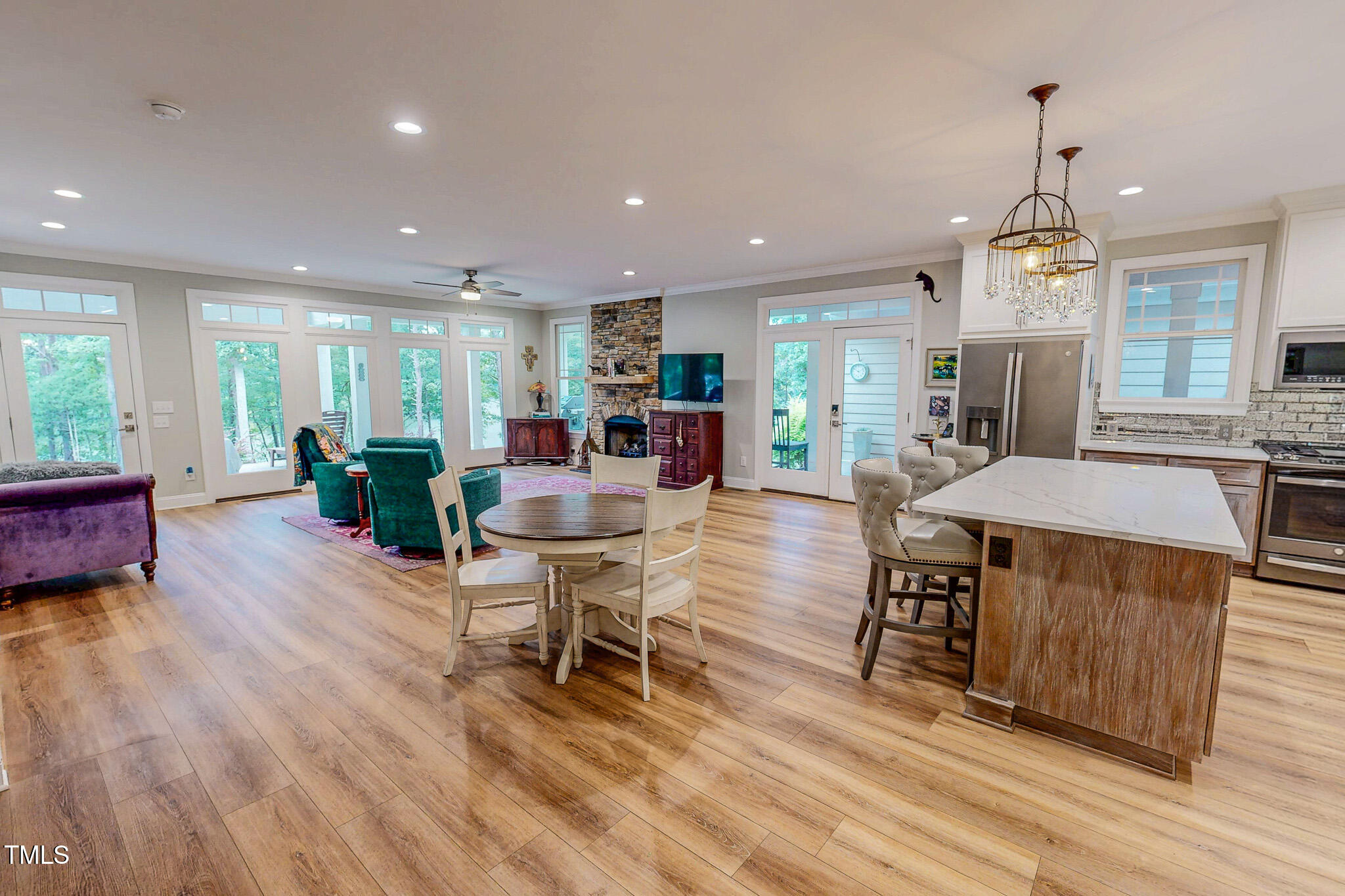 355 Fishermans Point Road Roxboro, NC 27574 - Photo 45 of 70 a view of a dining room with furniture window and wooden floor