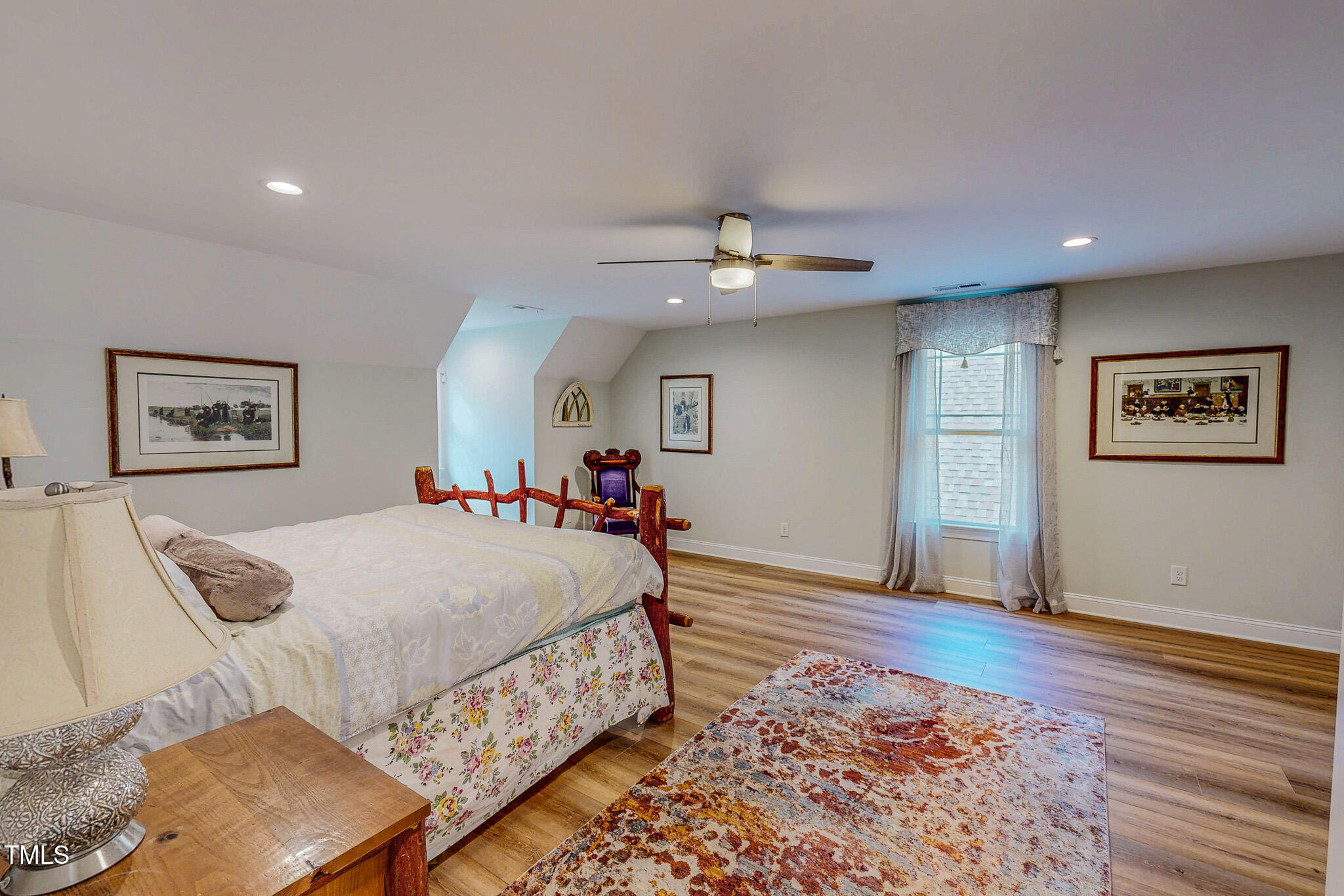 355 Fishermans Point Road Roxboro, NC 27574 - Photo 49 of 70 a bed room with a bed and a painting